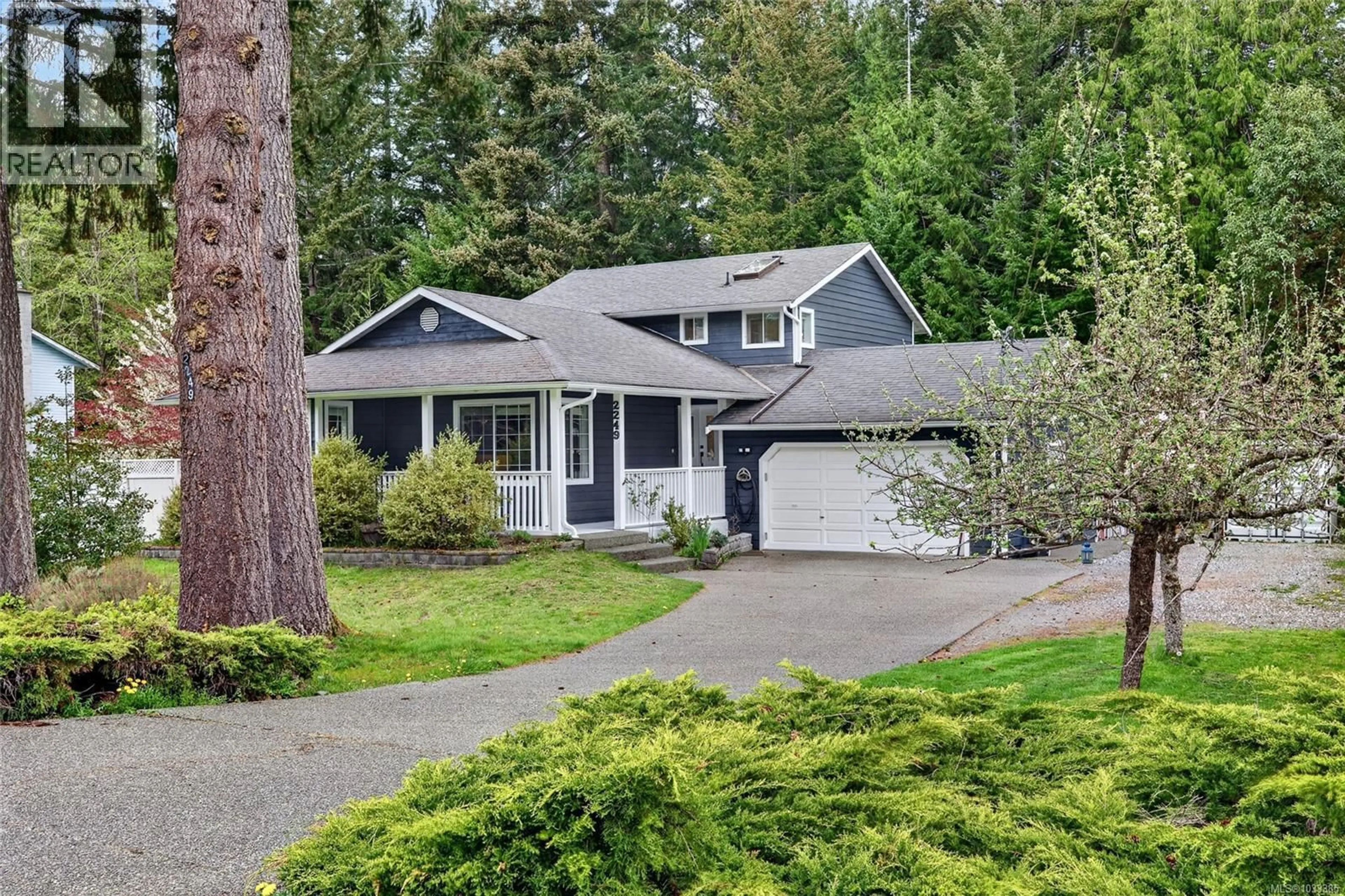 Home with vinyl exterior material, street for 2249 MCINTOSH ROAD, Shawnigan Lake British Columbia V0R2W1