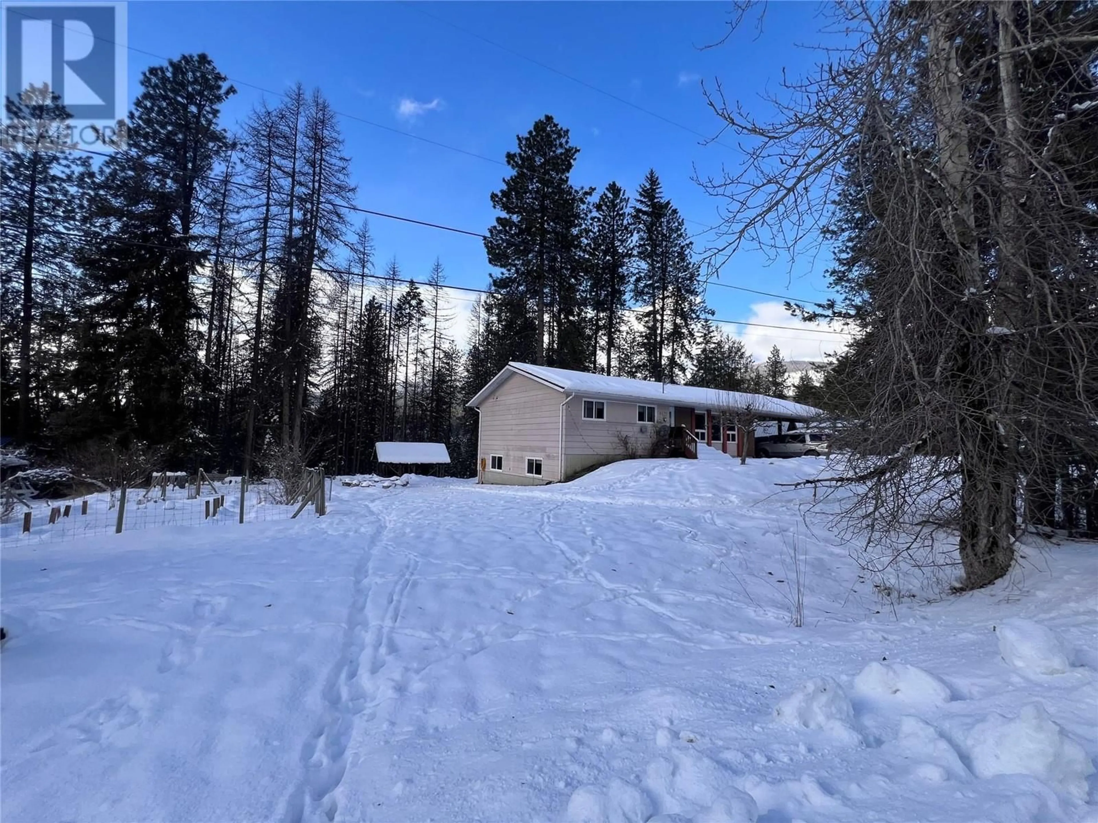 A pic from outside/outdoor area/front of a property/back of a property/a pic from drone, forest/trees view for 4670 MARRELLO Road, Nelson British Columbia V1L6X4