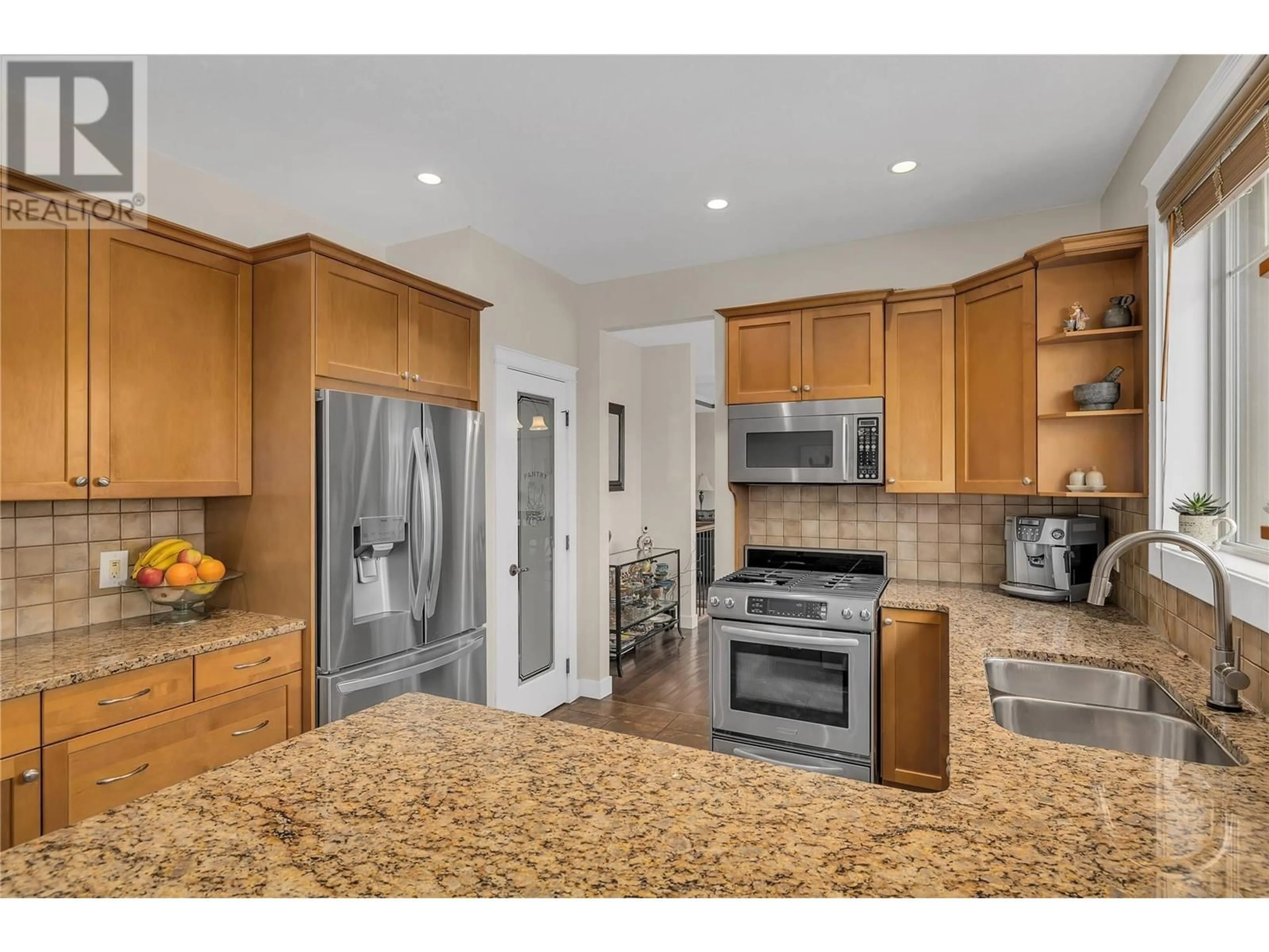Open concept kitchen, unknown for 737 KUIPERS CRESCENT, Kelowna British Columbia V1W5H4