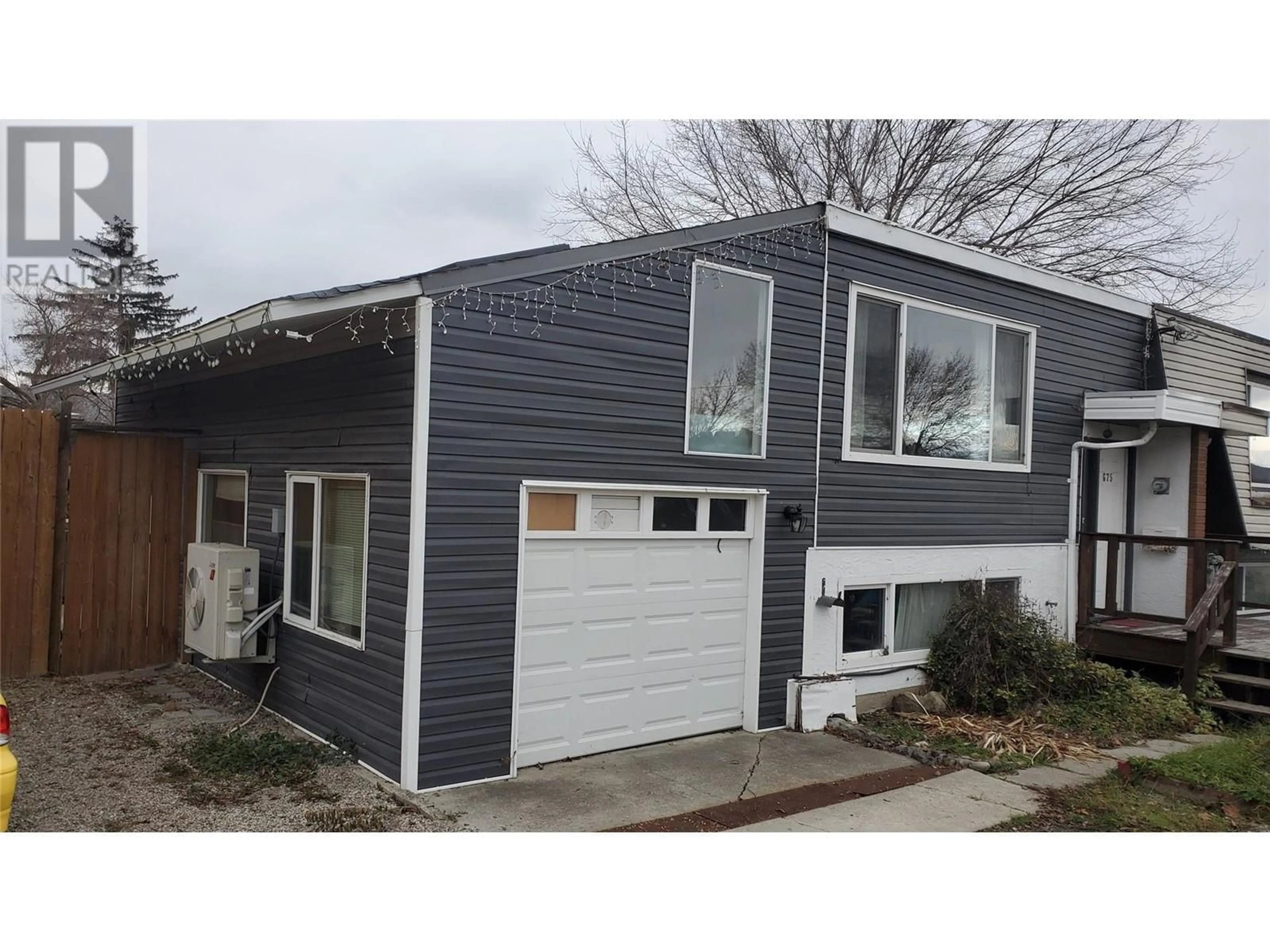 Home with vinyl exterior material, street for 675 Webster Road, Kelowna British Columbia V1X4V6