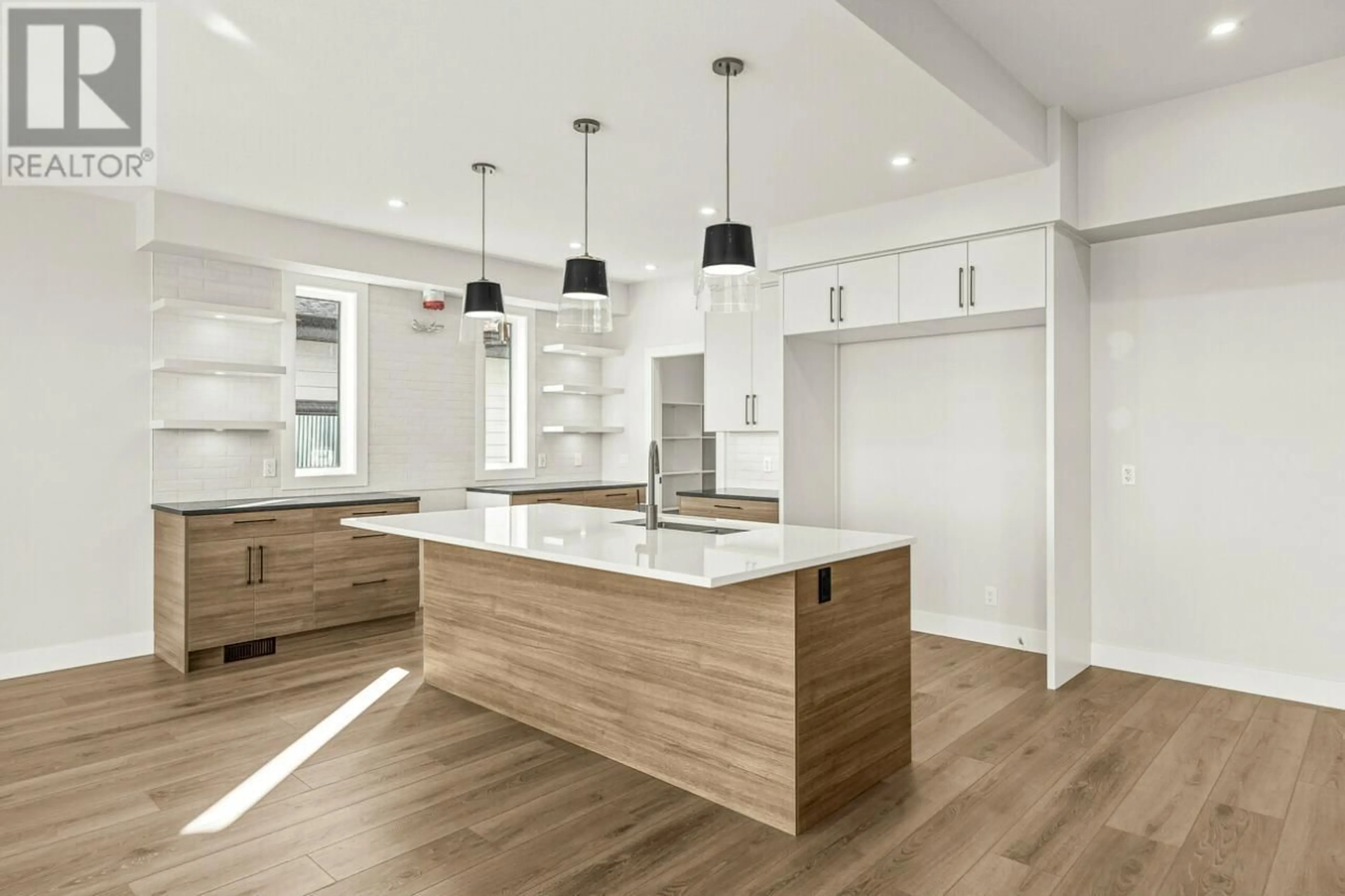 Open concept kitchen, wood/laminate floor for 1078 COLLINSON COURT, Kelowna British Columbia V1W0C3