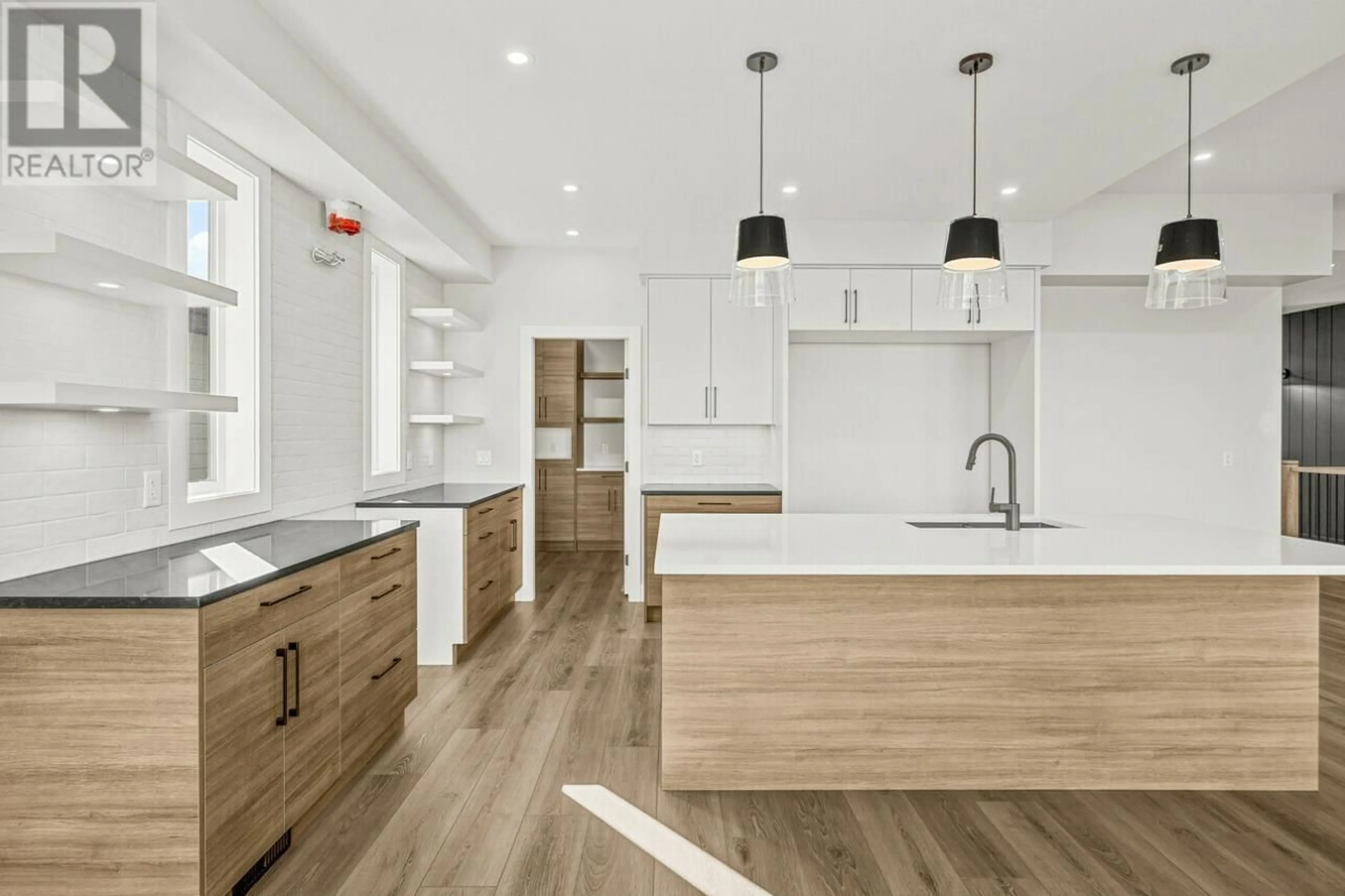 Open concept kitchen, wood/laminate floor for 1078 COLLINSON COURT, Kelowna British Columbia V1W0C3
