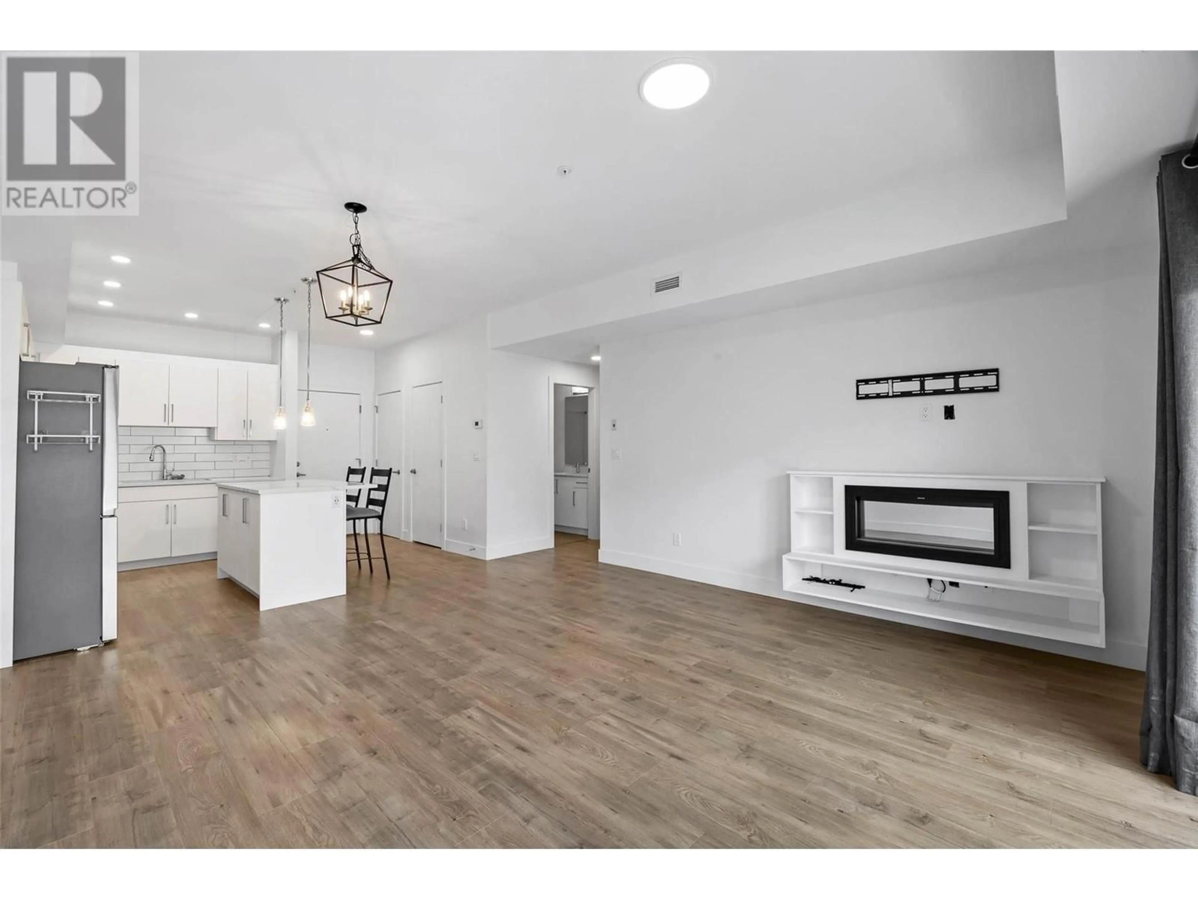 Open concept kitchen, wood/laminate floor for 217 - 2046 ROBSON PLACE, Kamloops British Columbia V2E0A5