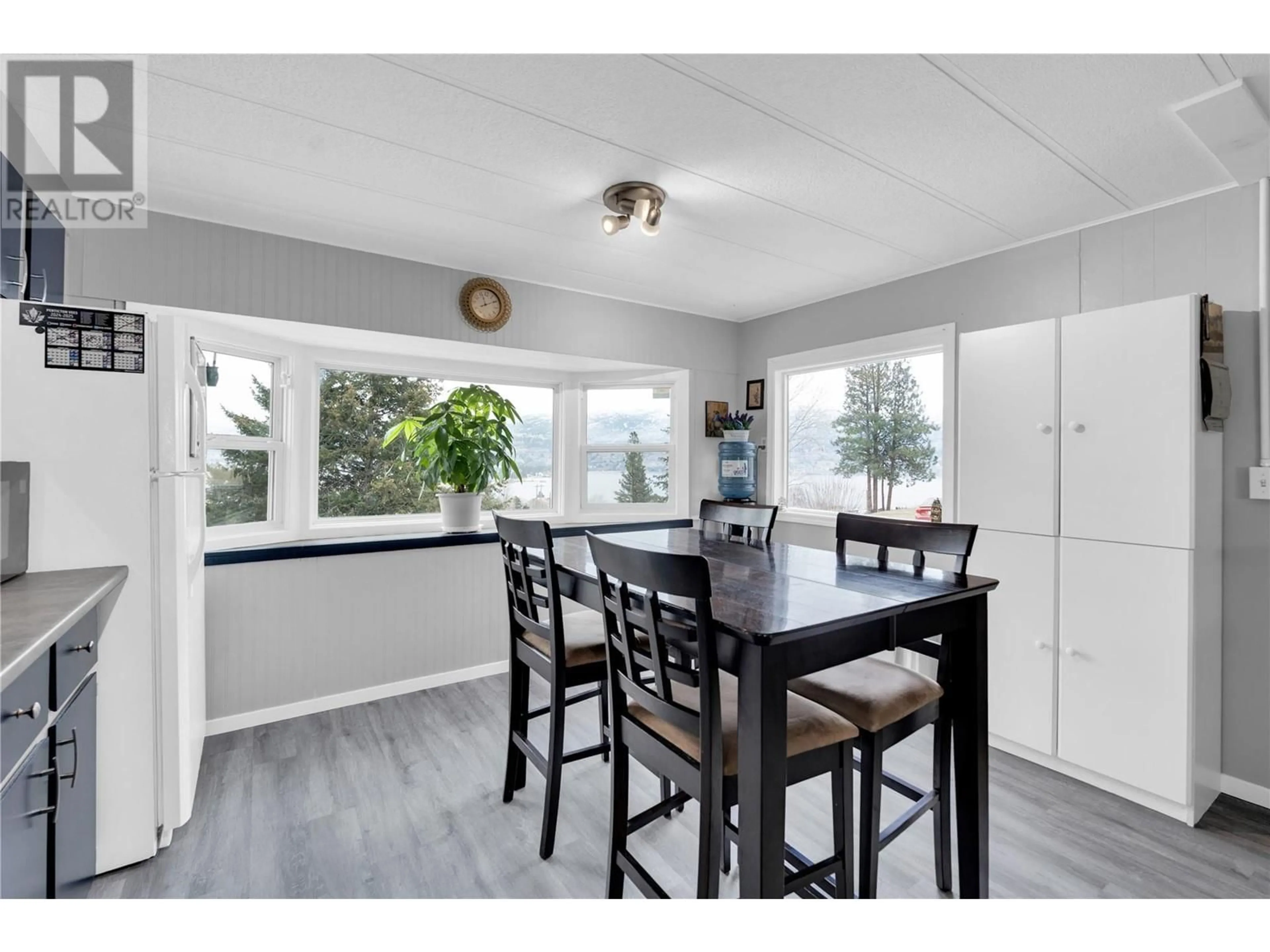 Open concept kitchen, wood/laminate floor for 201 Highway 97 Unit# 63, Penticton British Columbia V2A6J7