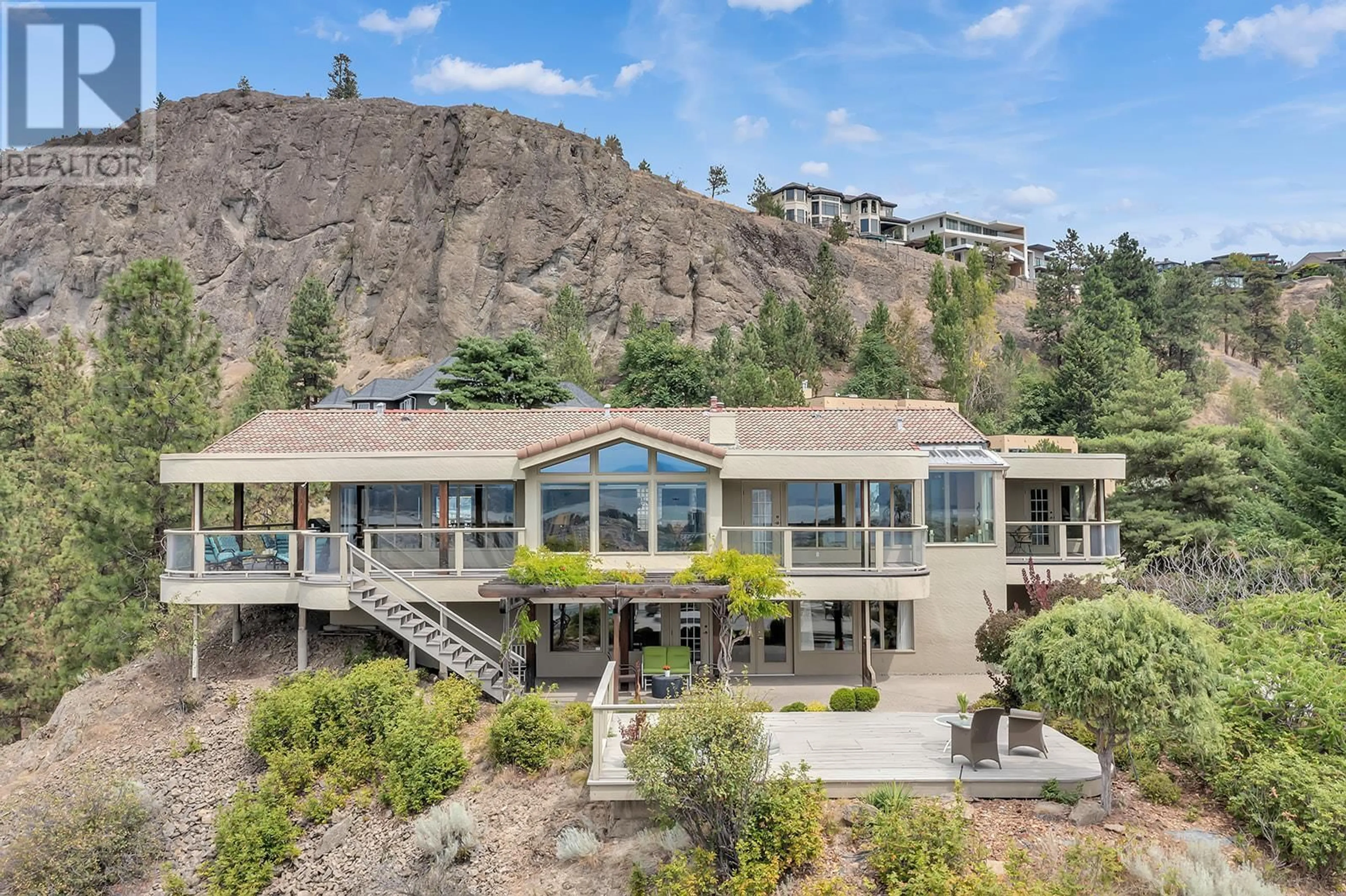 A pic from outside/outdoor area/front of a property/back of a property/a pic from drone, mountain view for 828 MOUNT ROYAL DRIVE, Kelowna British Columbia V1Y8G3