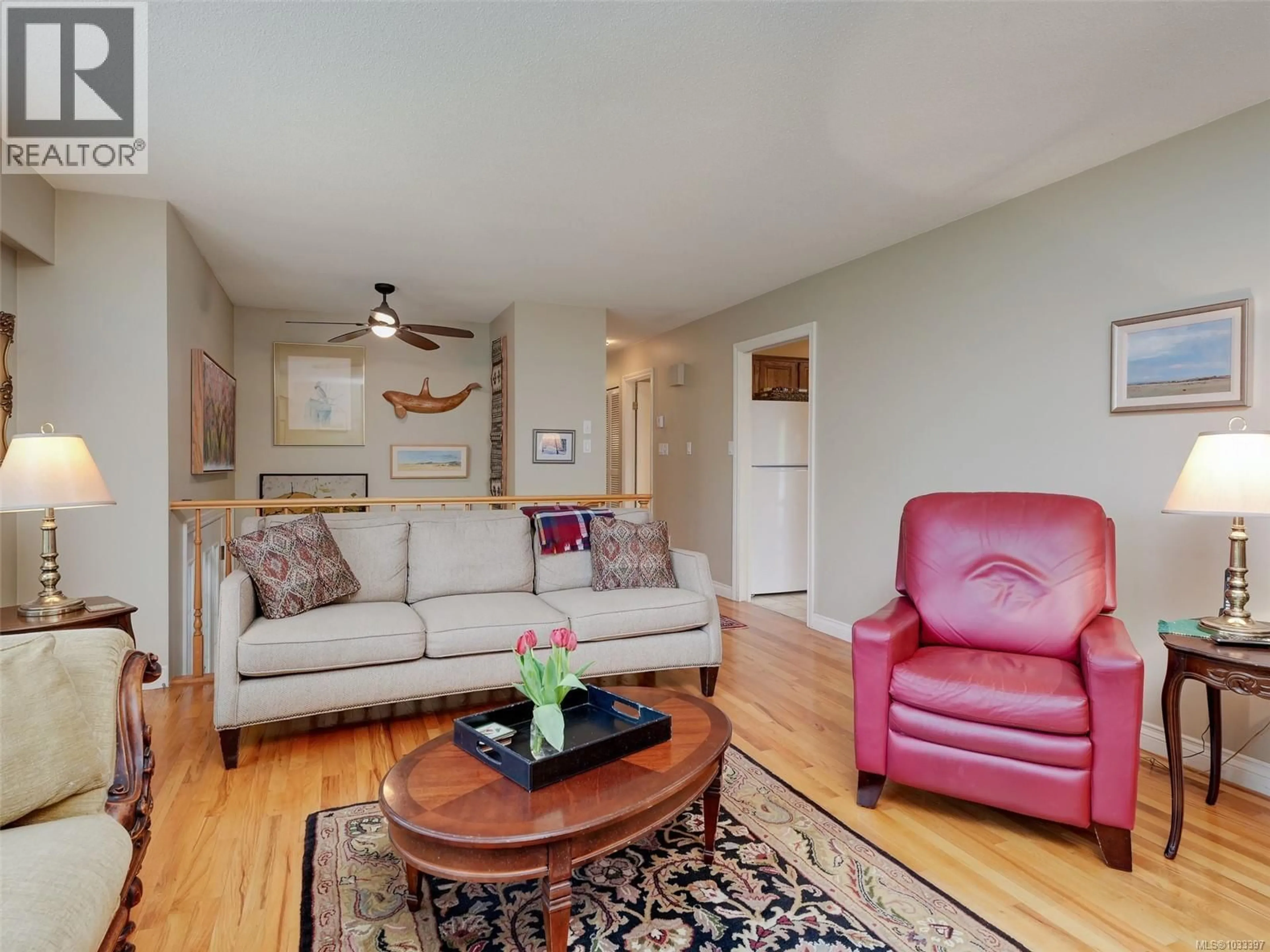 Living room with furniture, wood/laminate floor for 3904 LEXINGTON AVENUE, Saanich British Columbia V8N5K7