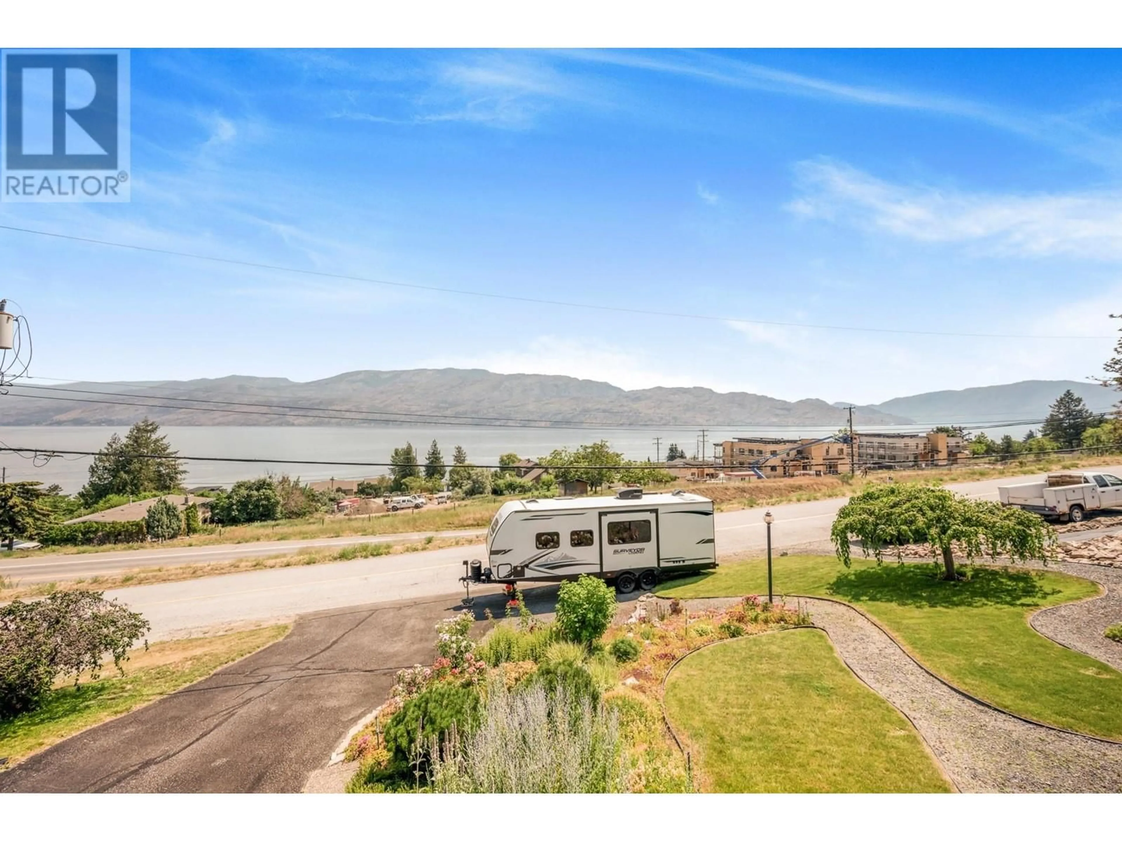 A pic from outside/outdoor area/front of a property/back of a property/a pic from drone, water/lake/river/ocean view for 5286 Huston Road, Peachland British Columbia V0H1X0