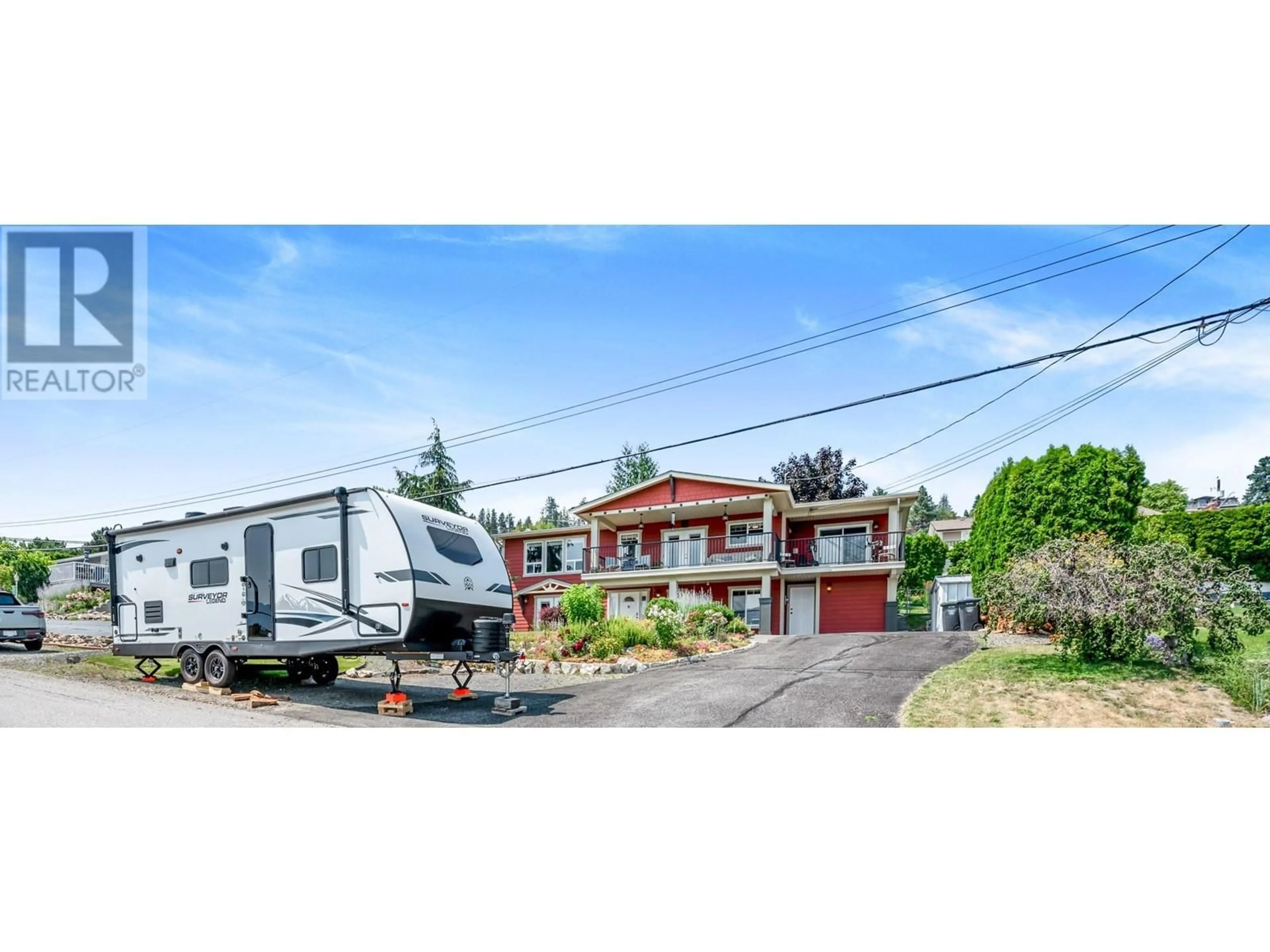 A pic from outside/outdoor area/front of a property/back of a property/a pic from drone, street for 5286 Huston Road, Peachland British Columbia V0H1X0