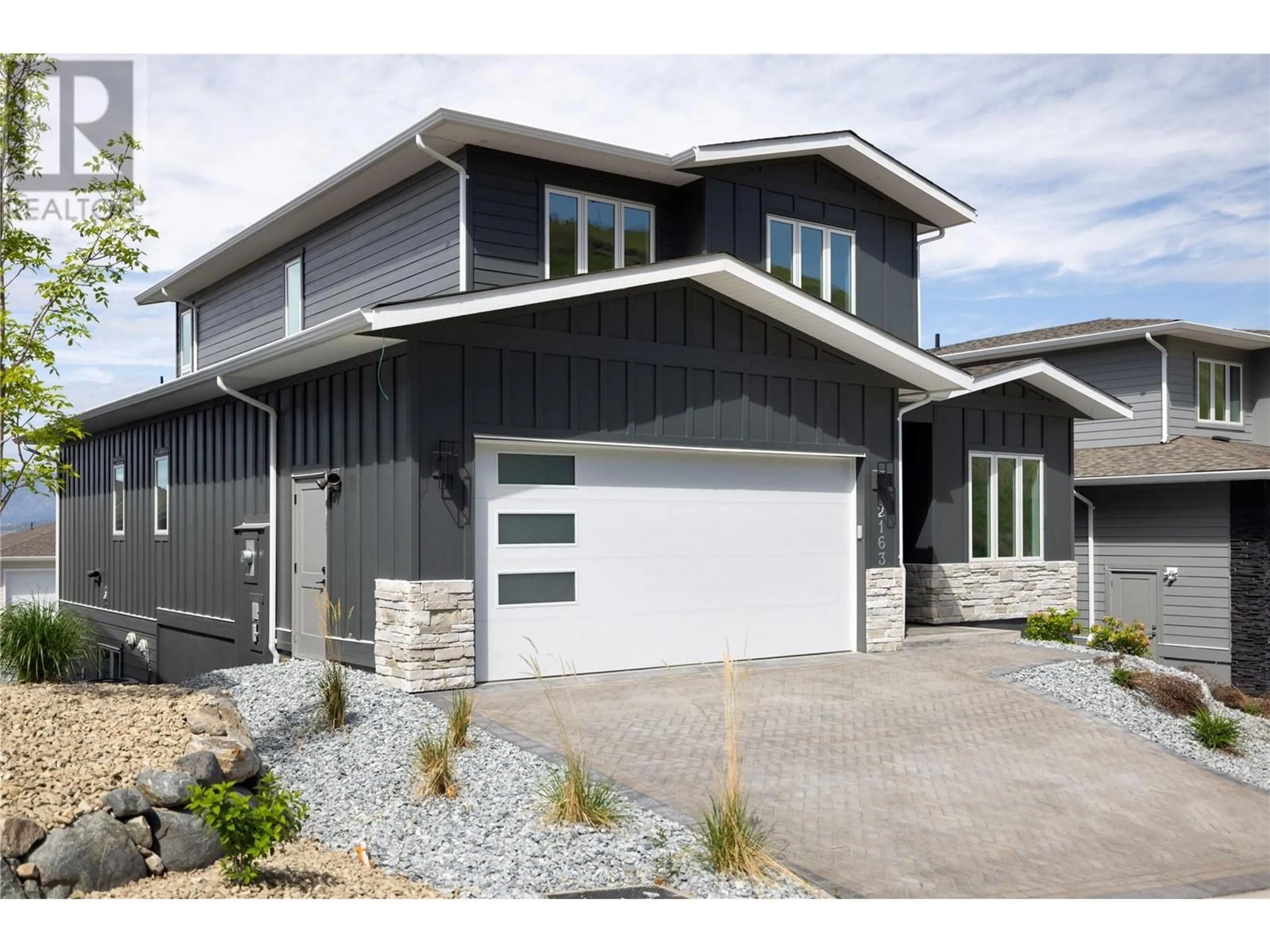 Home with vinyl exterior material, street for 2163 KENTUCKY CRESCENT, Kelowna British Columbia V1P0A2