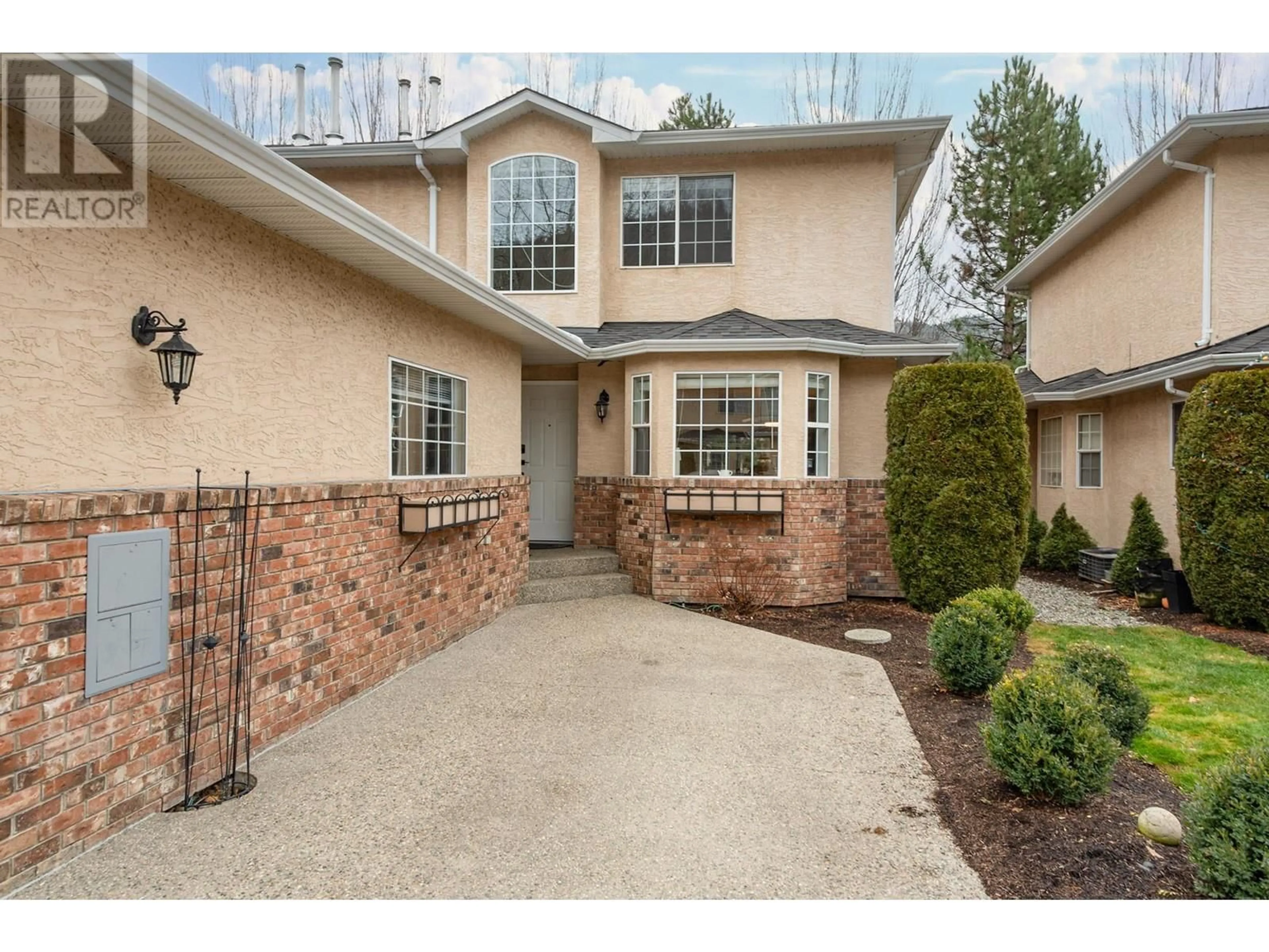 Home with brick exterior material, street for 527 Yates Road Unit# 9, Kelowna British Columbia V1V1Z5