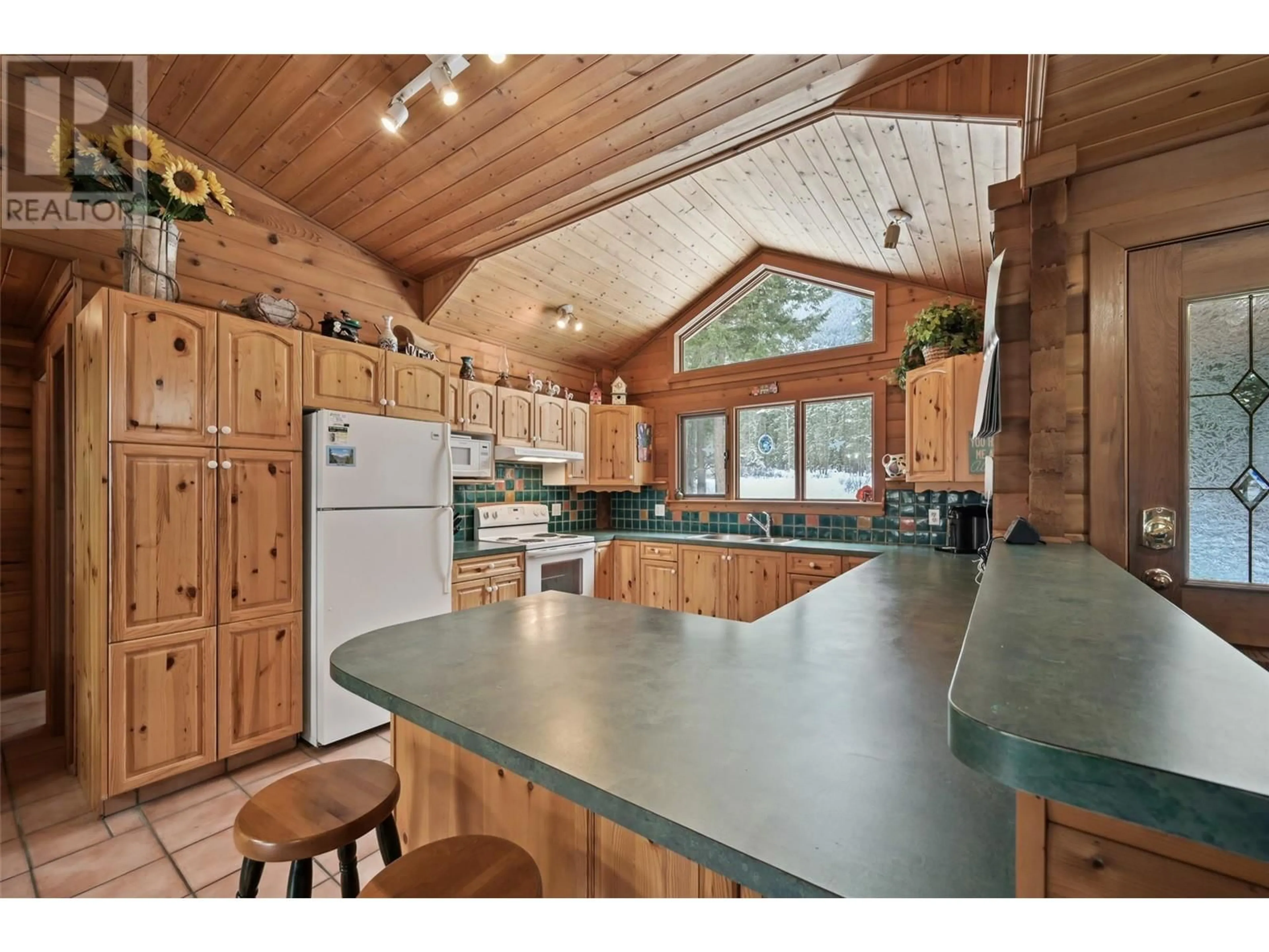 Open concept kitchen, wood/laminate floor for 2845 Berrey Road, Brisco British Columbia V0A1B0