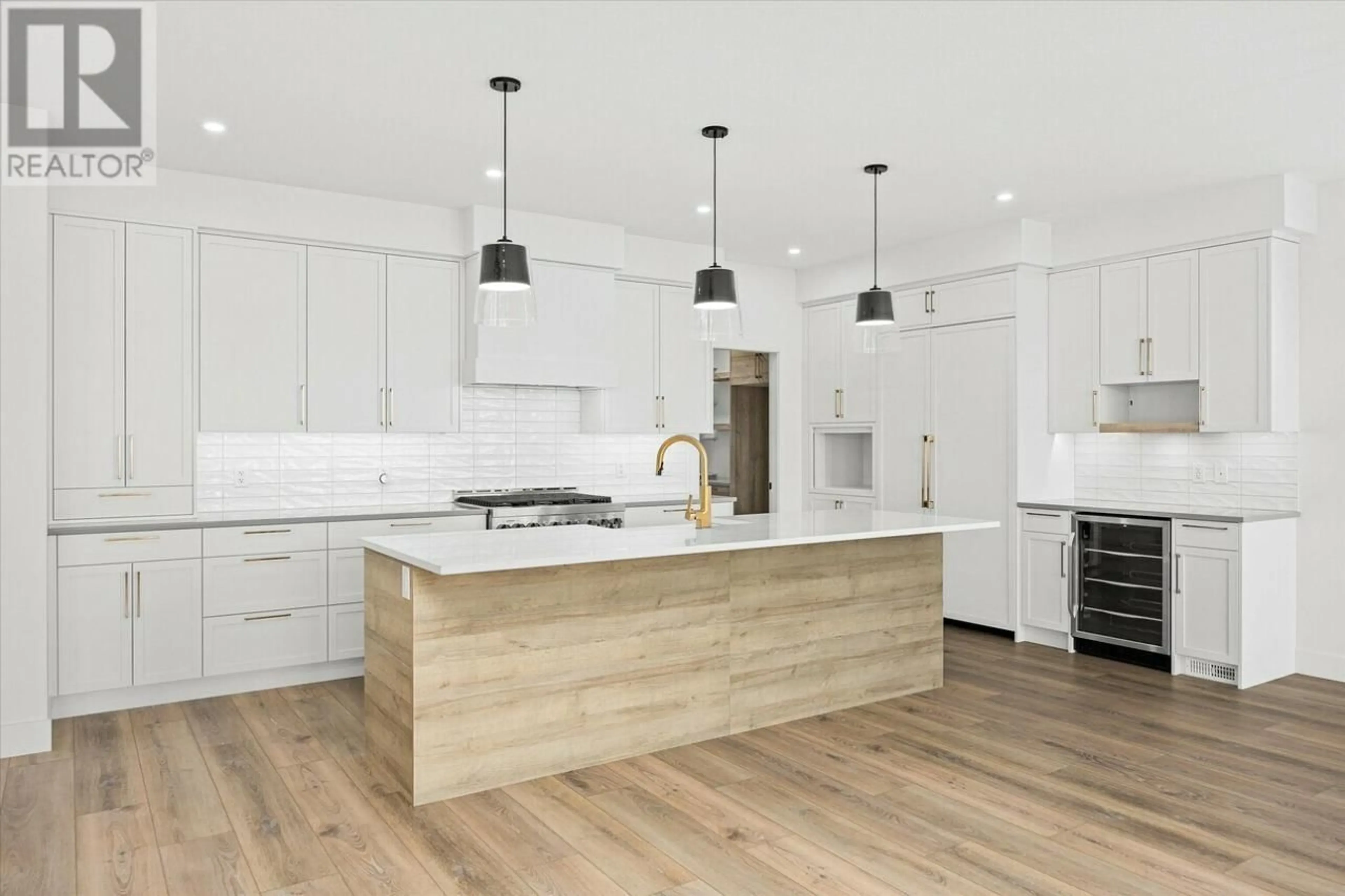 Contemporary kitchen, wood/laminate floor for 1108 Collinson Court, Kelowna British Columbia V1W0C3