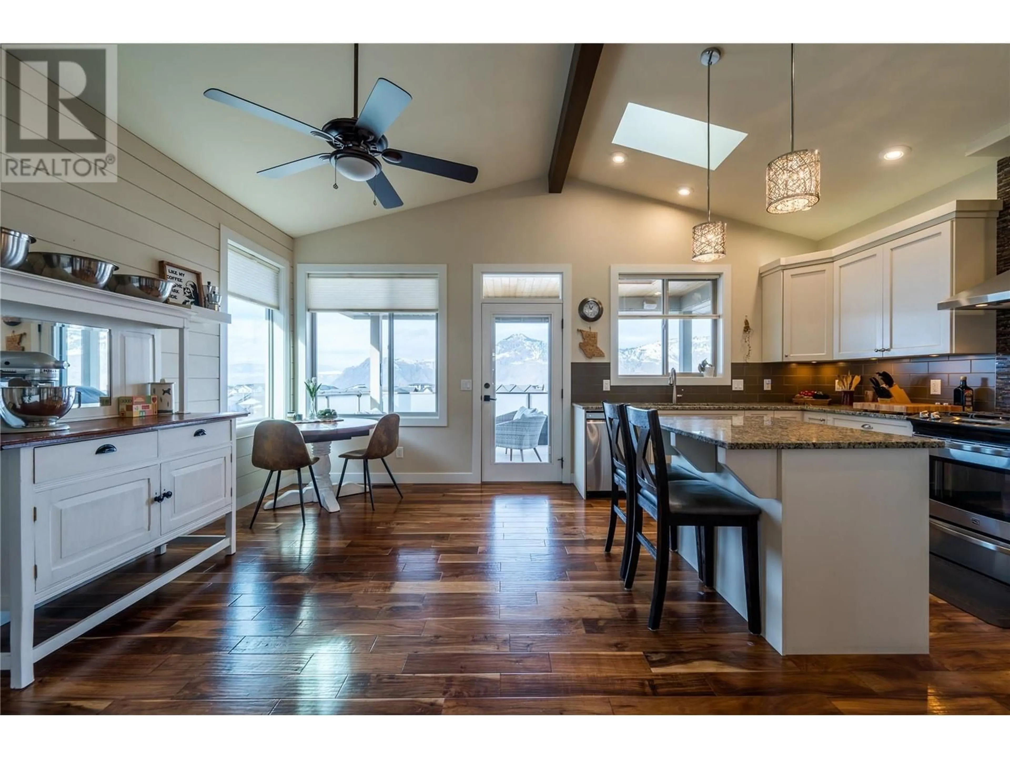 Open concept kitchen, wood/laminate floor for 2024 Galore Crescent, Kamloops British Columbia V2E0A7