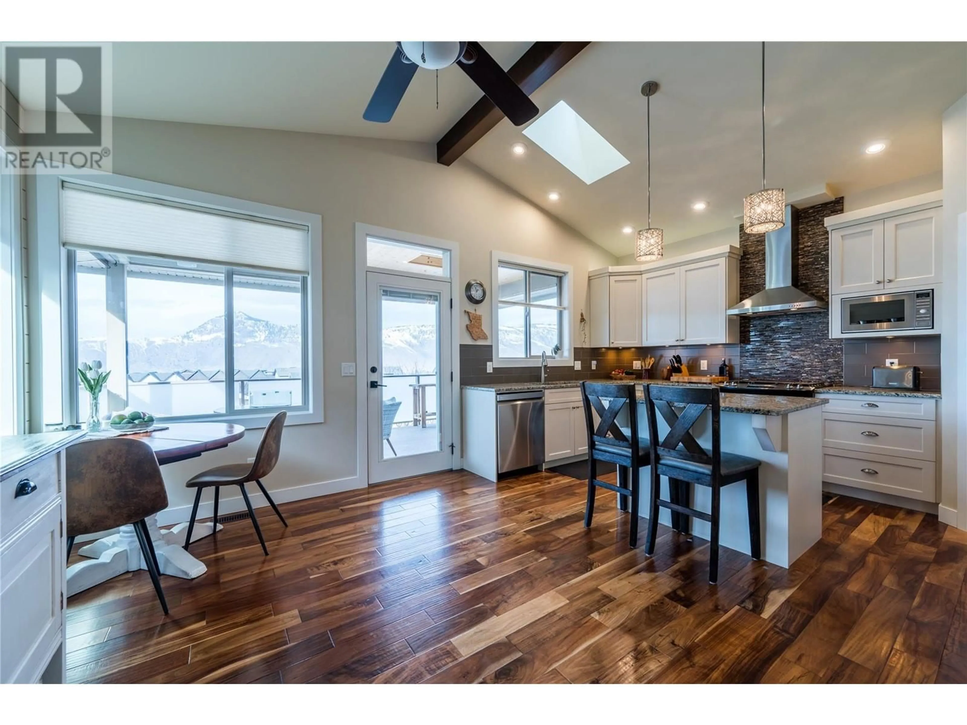 Open concept kitchen, wood/laminate floor for 2024 Galore Crescent, Kamloops British Columbia V2E0A7