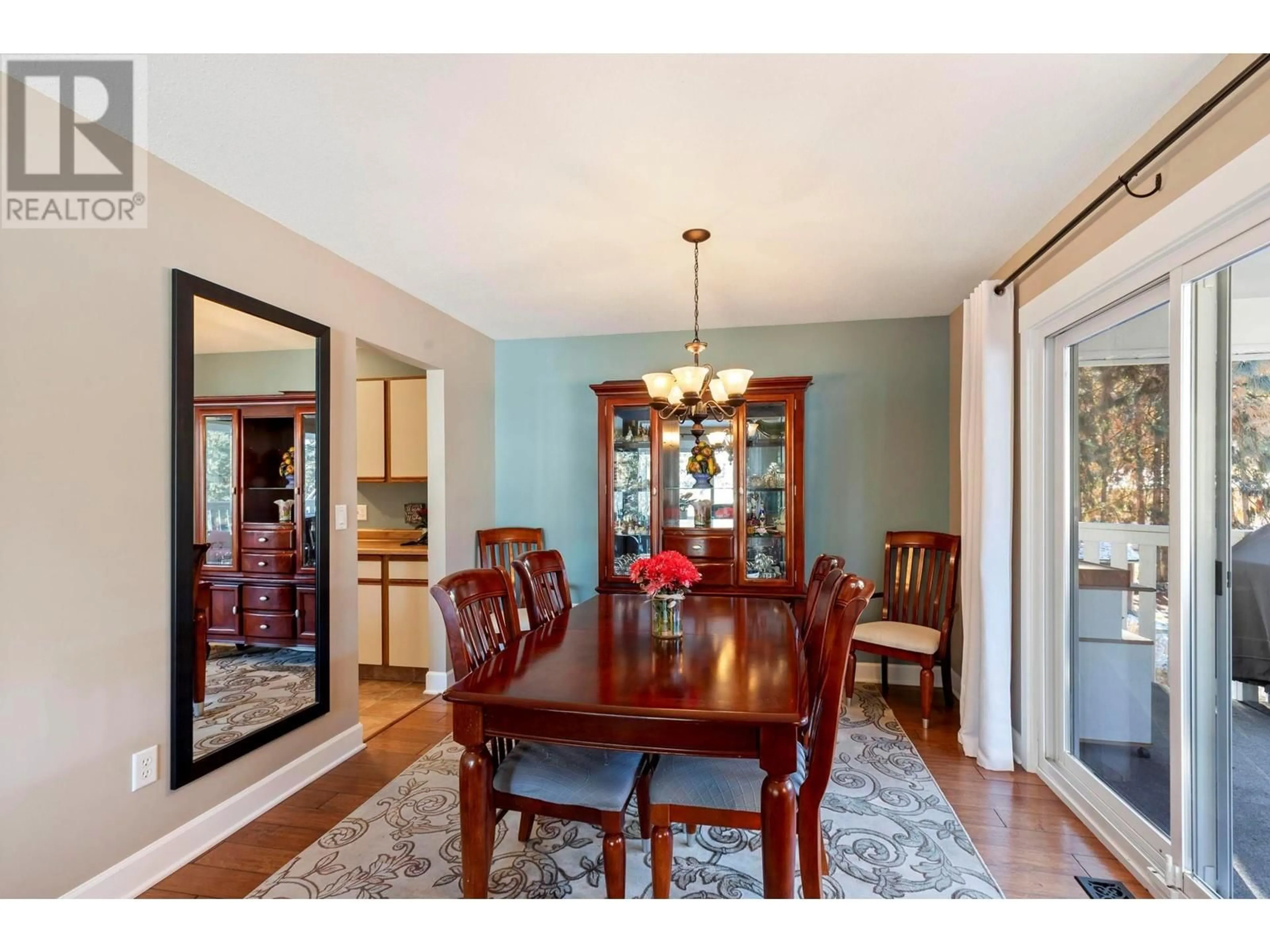 Dining room, wood/laminate floor for 4764 Gordon Drive, Kelowna British Columbia V1W4P3