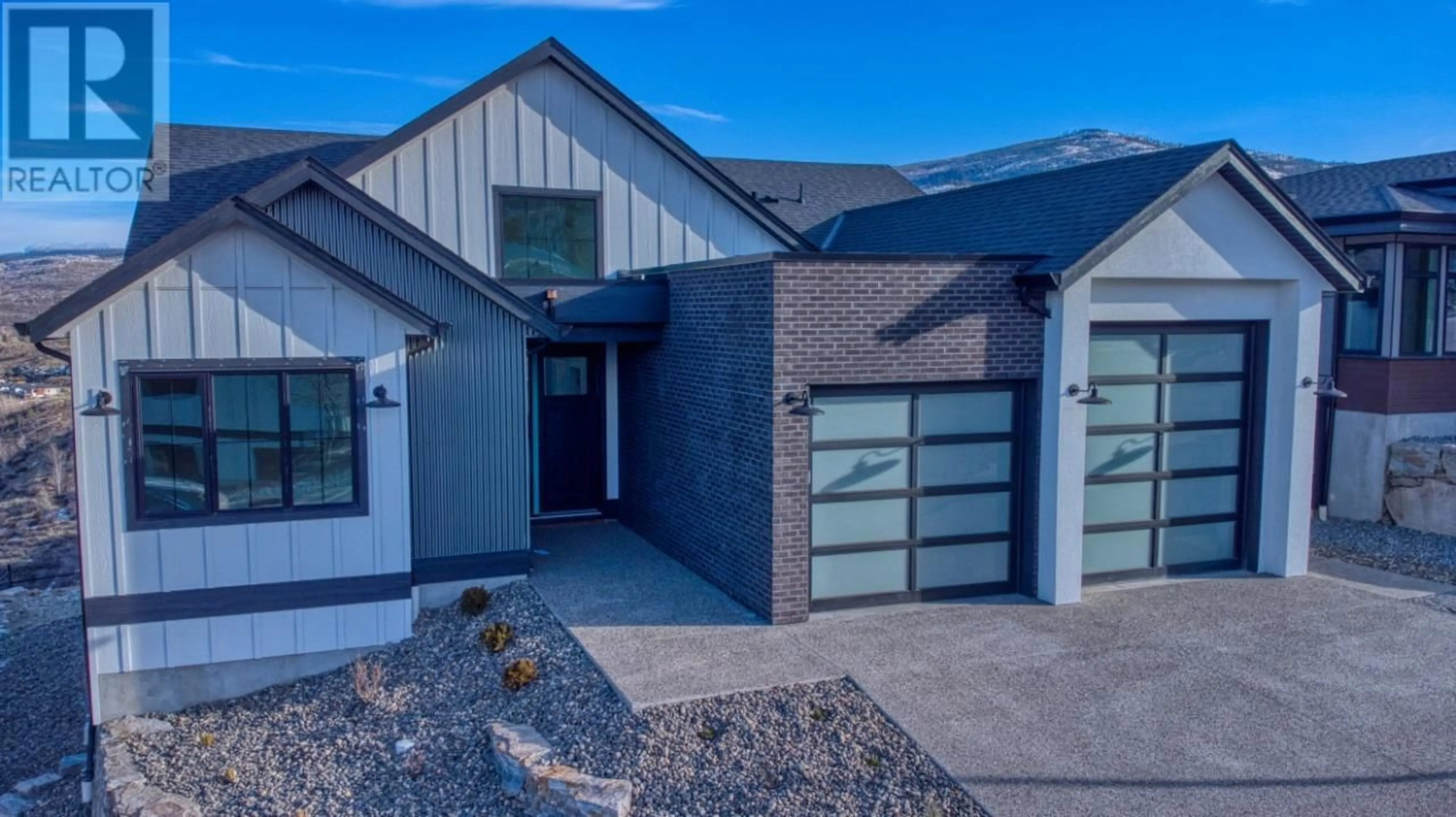 Home with brick exterior material, street for 1066 EMSLIE STREET, Kelowna British Columbia V1W0C3