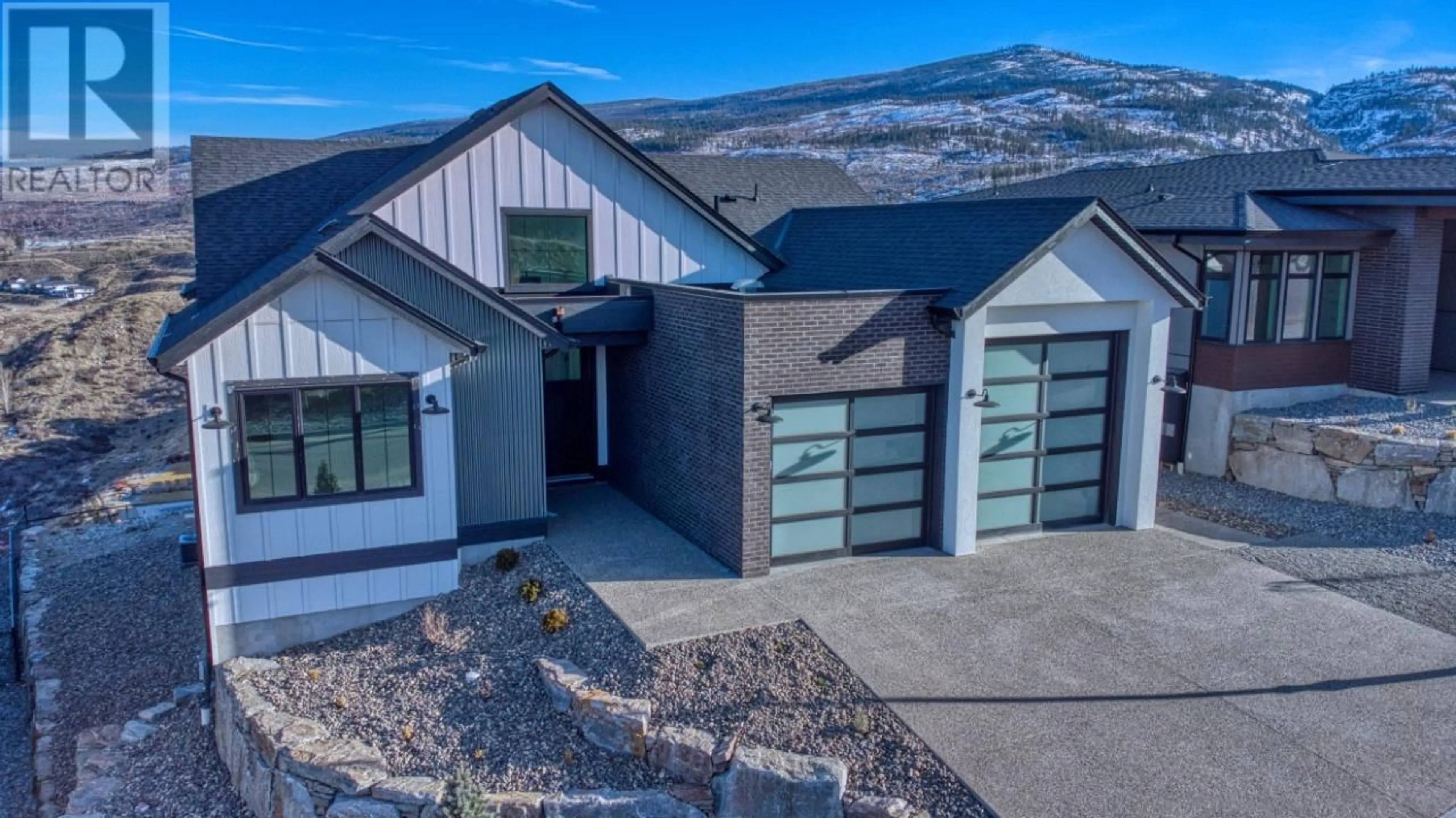 Home with vinyl exterior material, mountain view for 1066 Emslie Street, Kelowna British Columbia V1W0C3