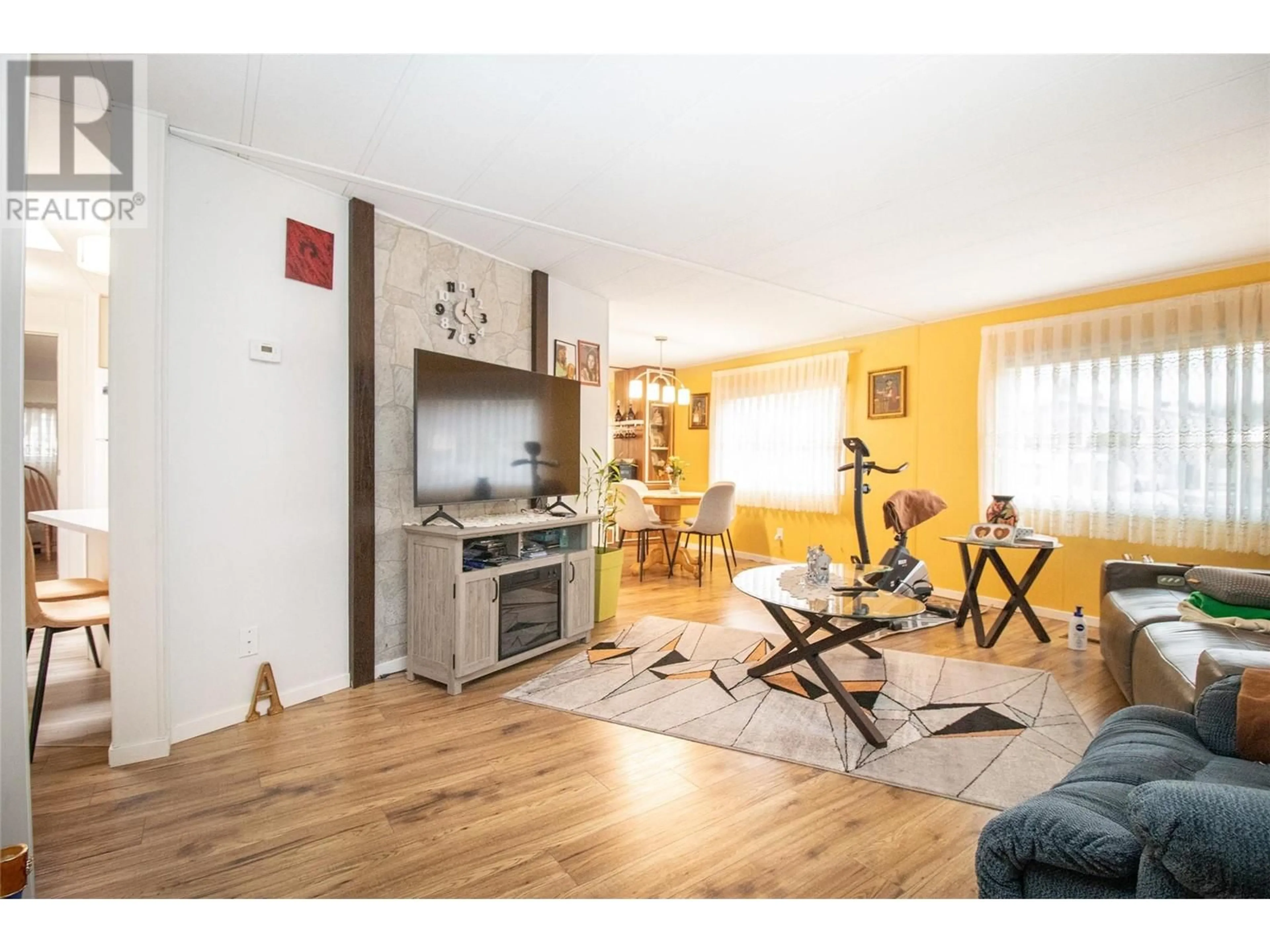 Living room with furniture, wood/laminate floor for 141 - 1880 OLD BOUCHERIE ROAD, West Kelowna British Columbia V4T1Z3