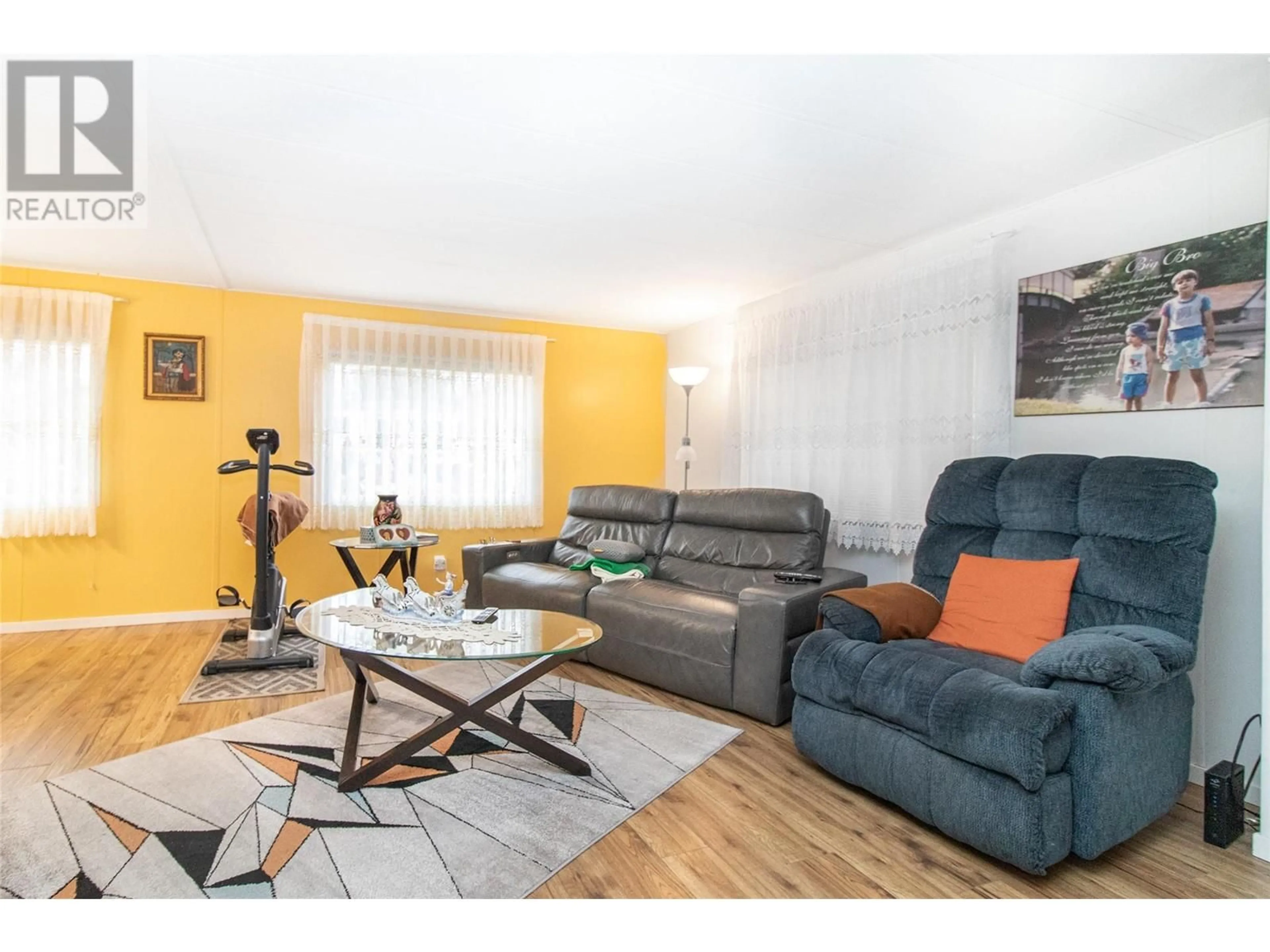 Living room with furniture, wood/laminate floor for 141 - 1880 OLD BOUCHERIE ROAD, West Kelowna British Columbia V4T1Z3