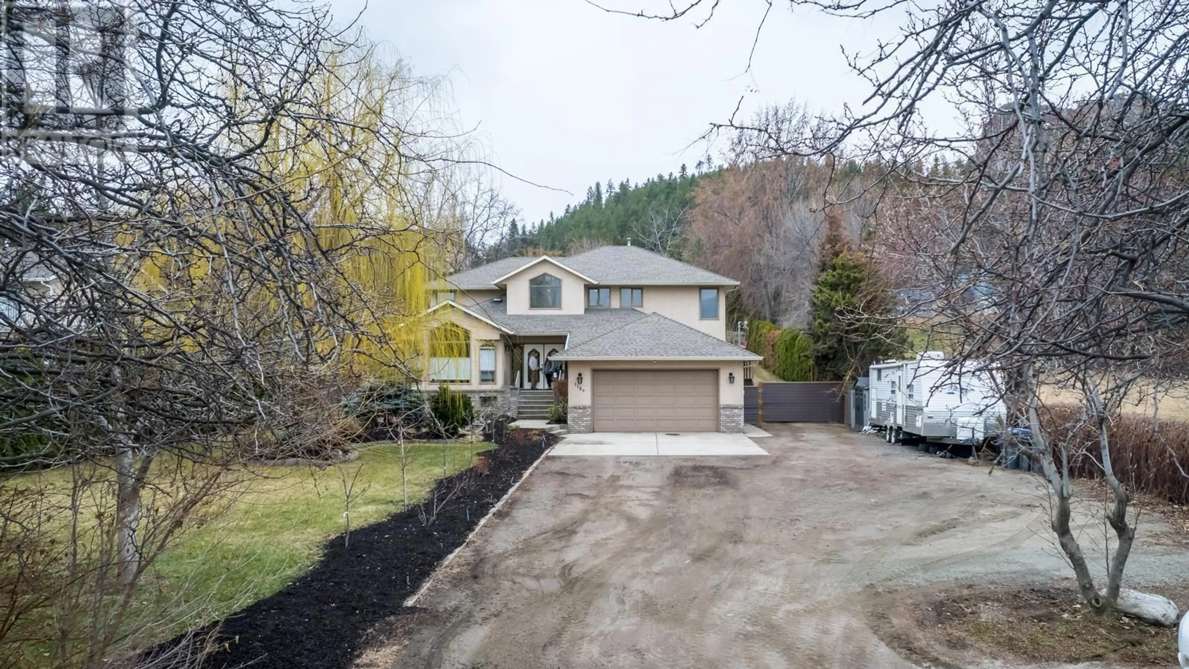 A pic from outside/outdoor area/front of a property/back of a property/a pic from drone, street for 1189 HUDSON ROAD, West Kelowna British Columbia V1Z1J2