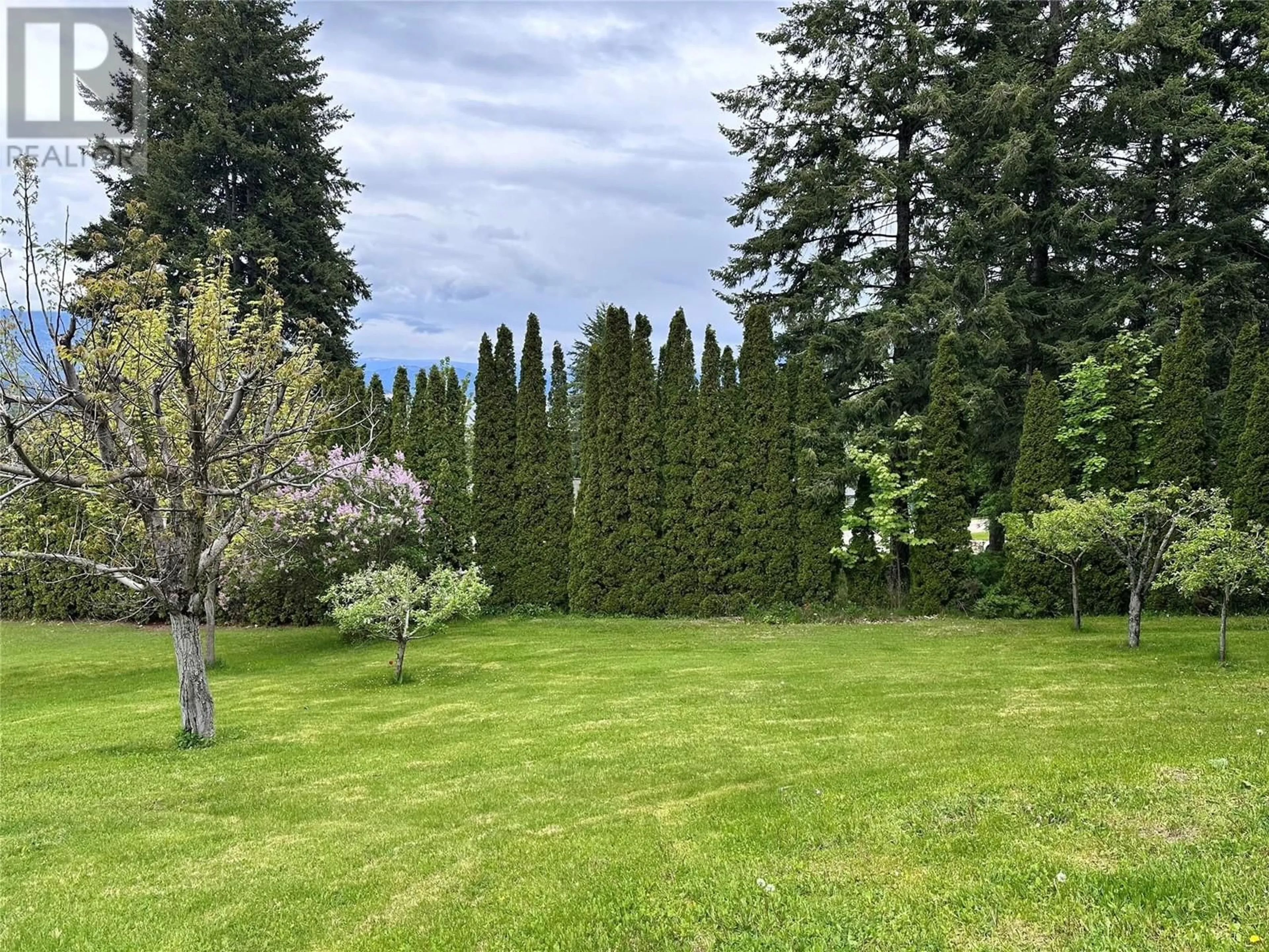 A pic from outside/outdoor area/front of a property/back of a property/a pic from drone, forest/trees view for 1681 12 AVENUE SOUTHEAST, Salmon Arm British Columbia V1E2E4