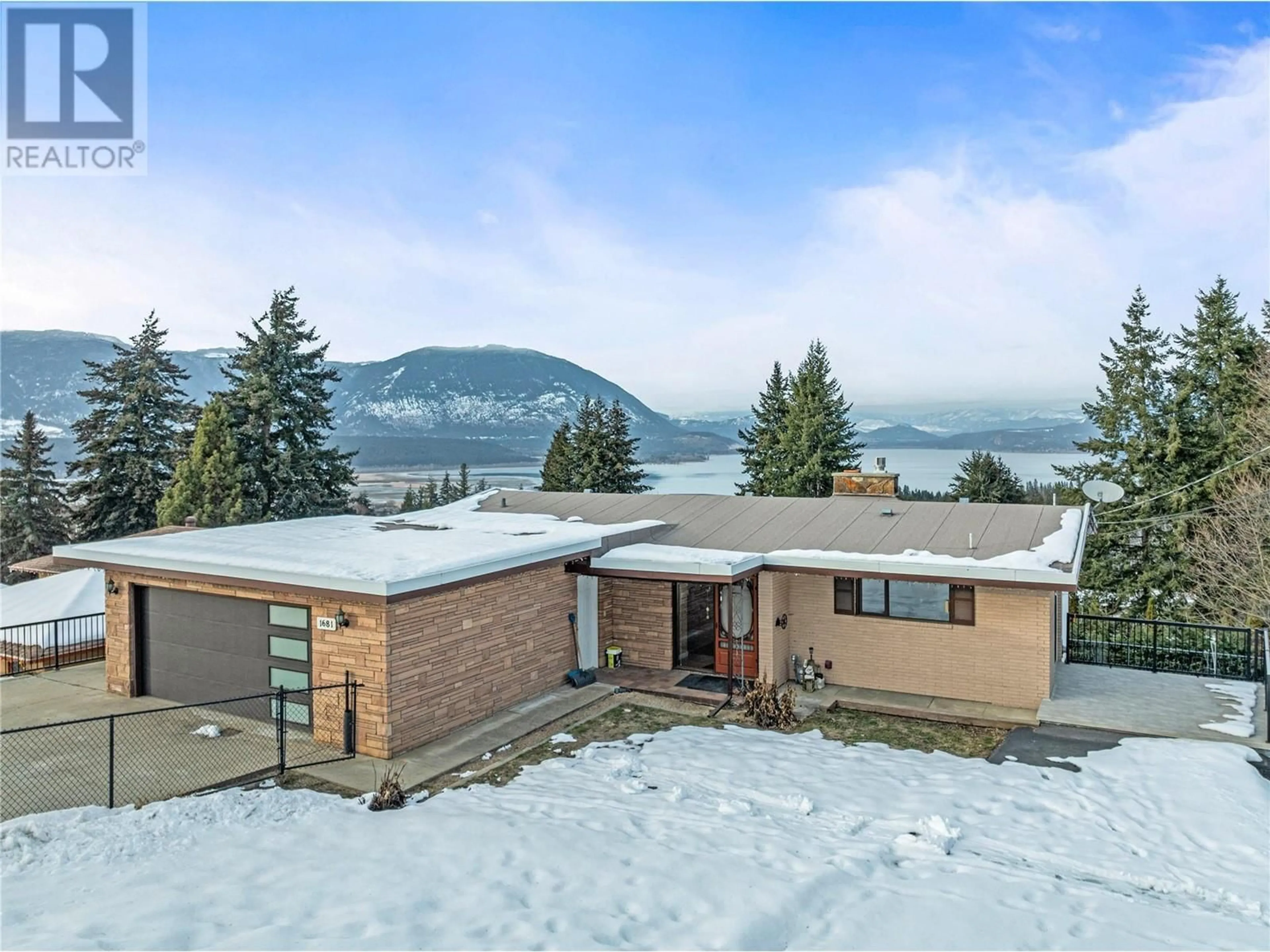 A pic from outside/outdoor area/front of a property/back of a property/a pic from drone, mountain view for 1681 12 Avenue SE, Salmon Arm British Columbia V1E2E4