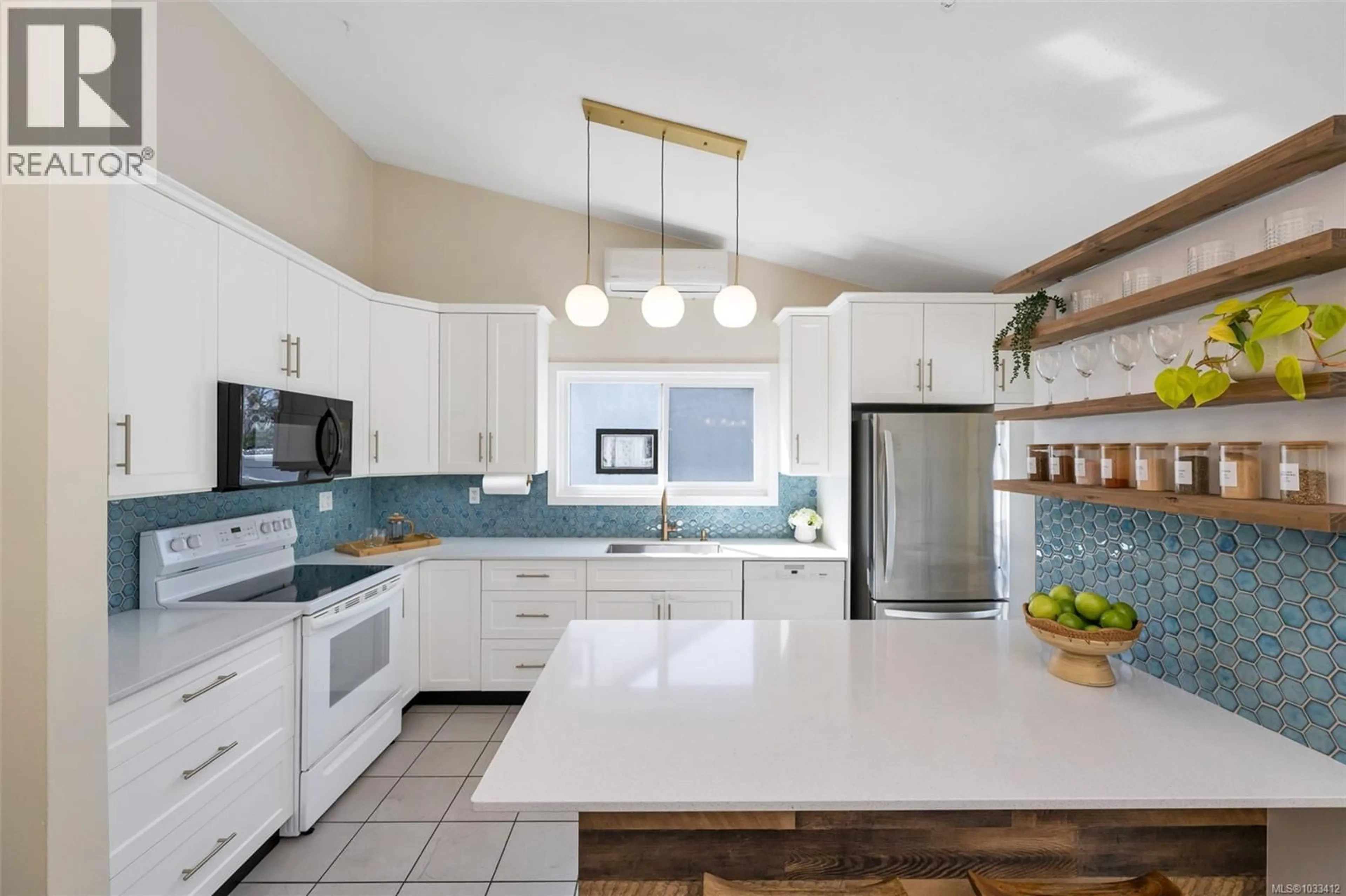 Open concept kitchen, ceramic/tile floor for 1826 NEWTON STREET, Saanich British Columbia V8R2R4