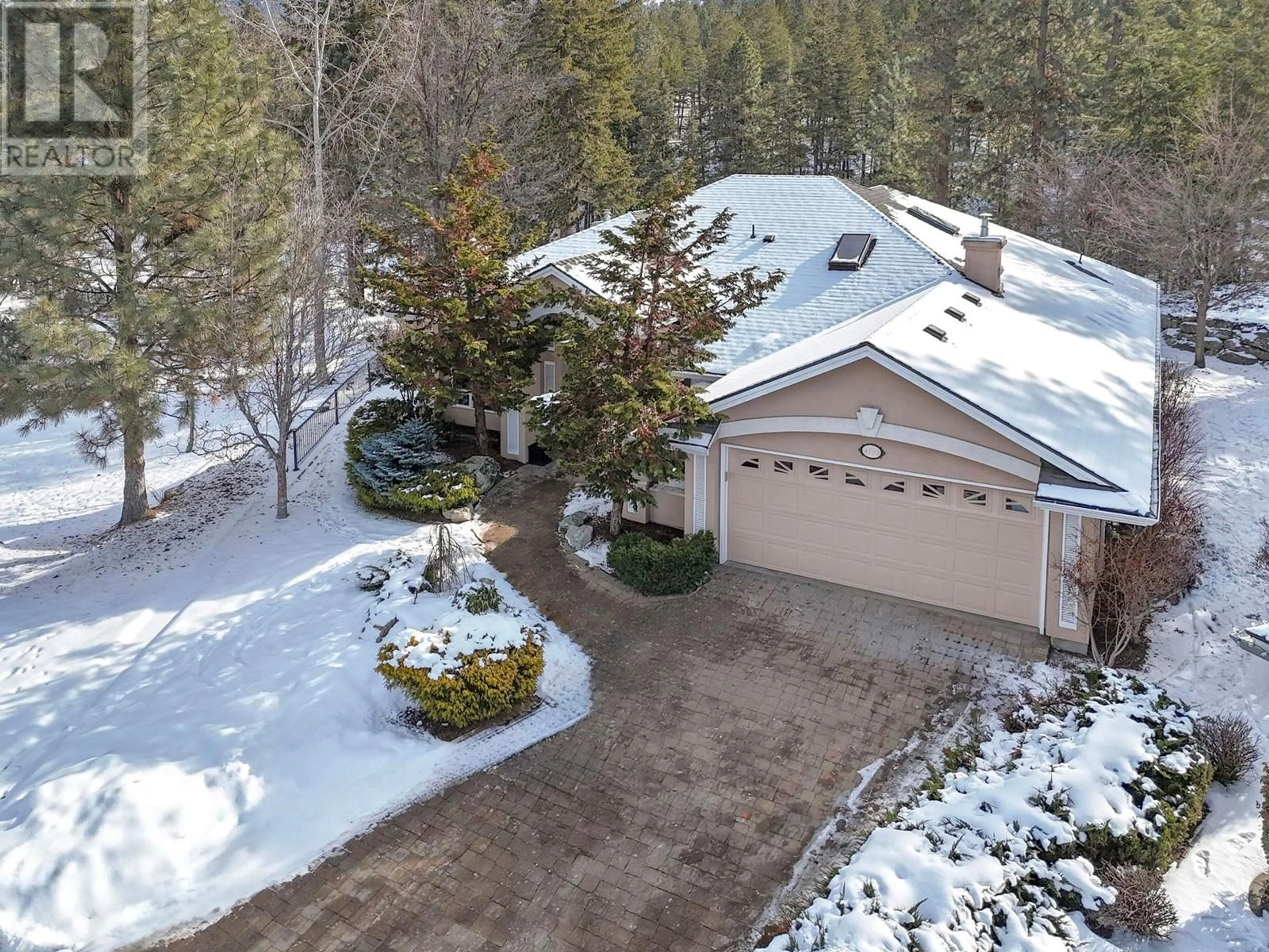 A pic from outside/outdoor area/front of a property/back of a property/a pic from drone, forest/trees view for 4190 Gallaghers Forest S, Kelowna British Columbia V1W5E4