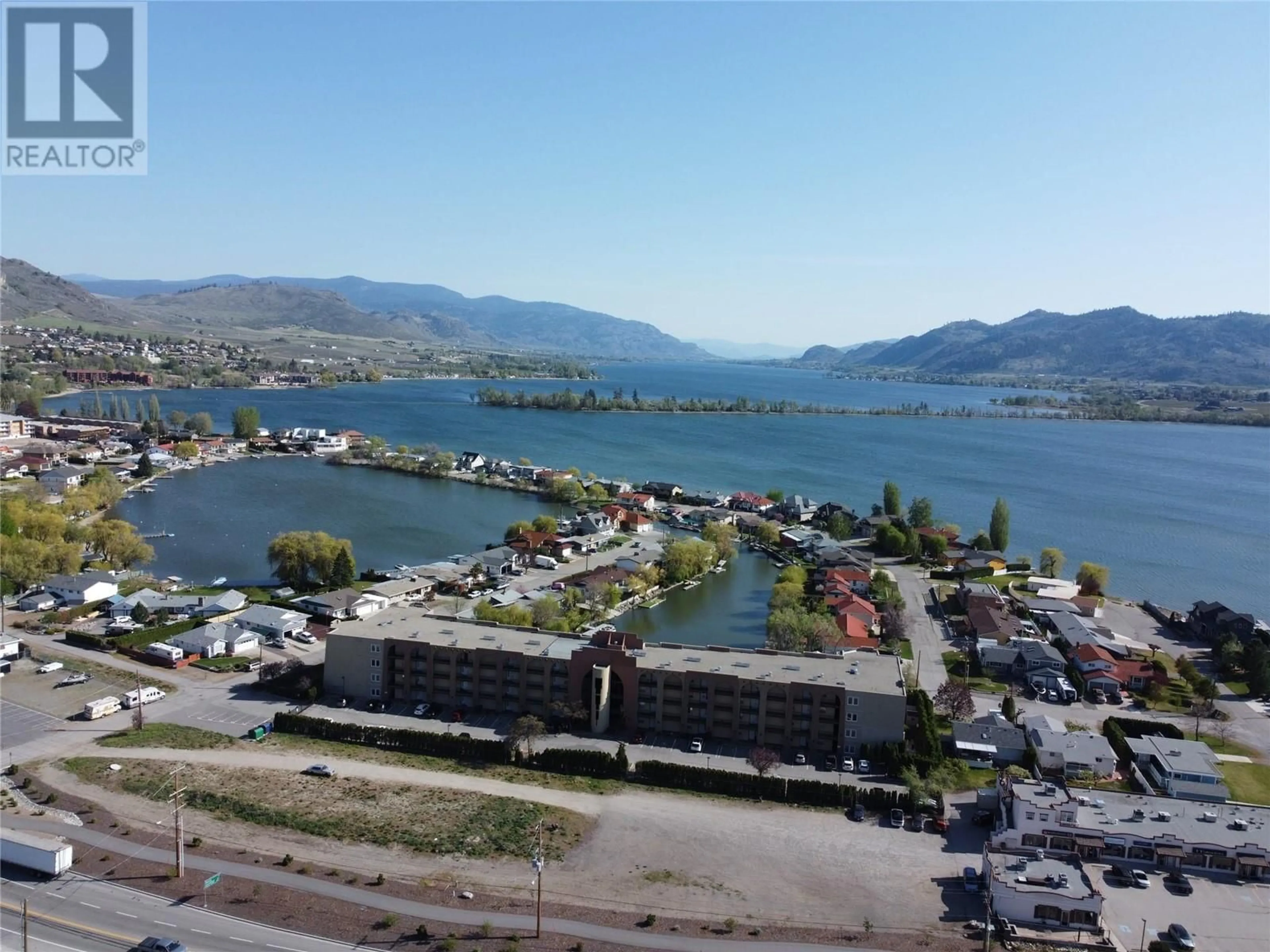 A pic from outside/outdoor area/front of a property/back of a property/a pic from drone, water/lake/river/ocean view for 15 SOLANA KEY Court Unit# 210, Osoyoos British Columbia V0H1V4