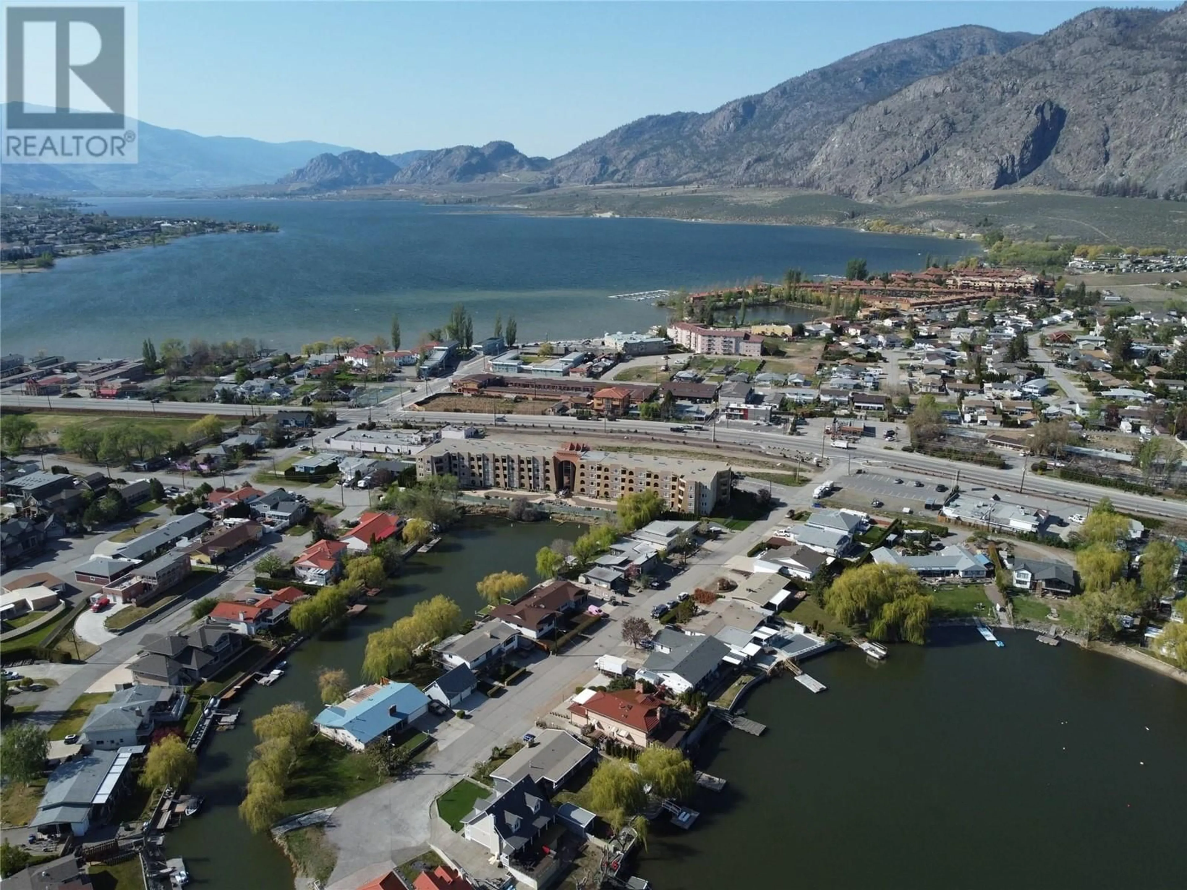 A pic from outside/outdoor area/front of a property/back of a property/a pic from drone, water/lake/river/ocean view for 15 SOLANA KEY Court Unit# 210, Osoyoos British Columbia V0H1V4