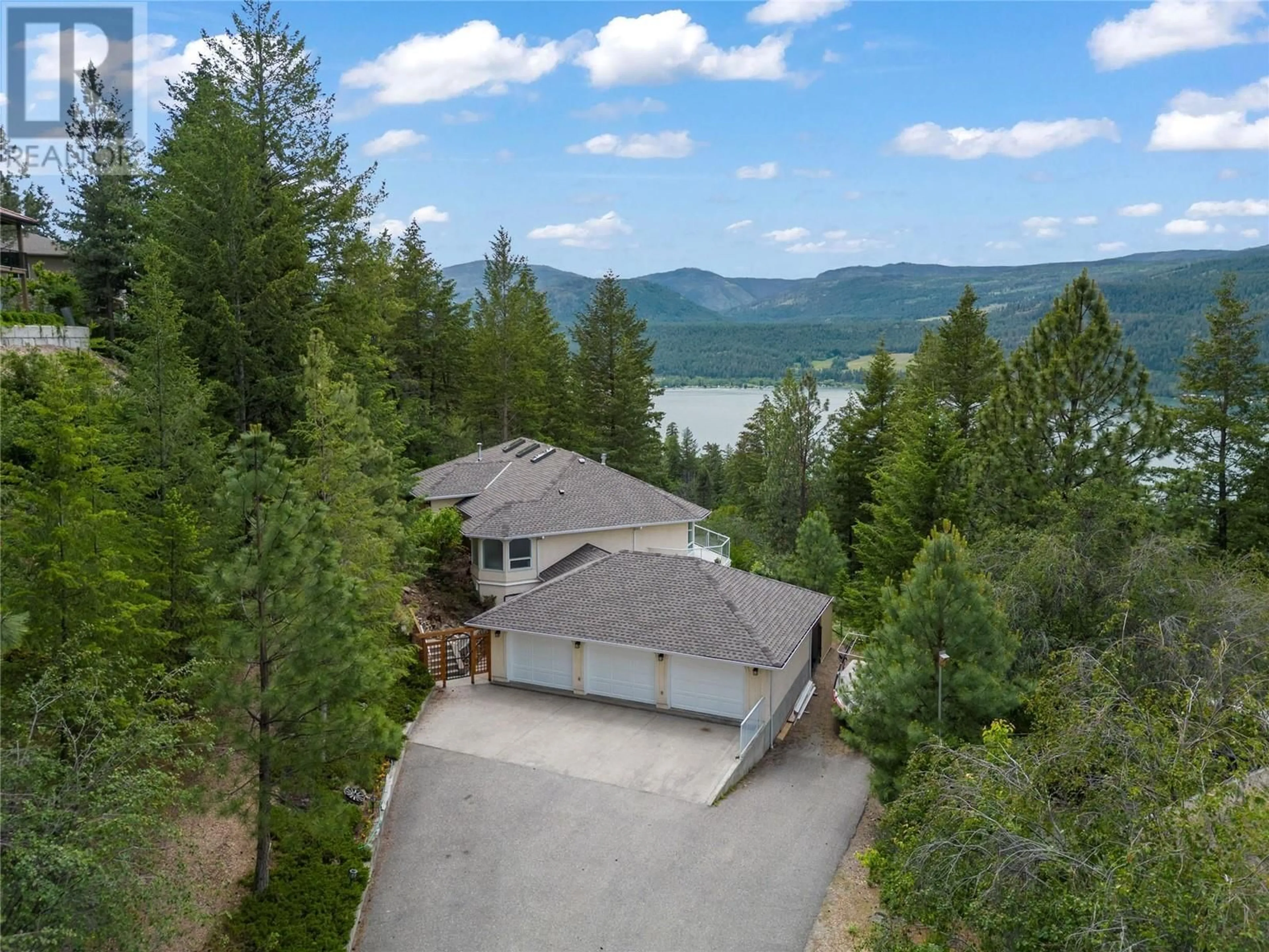 A pic from outside/outdoor area/front of a property/back of a property/a pic from drone, water/lake/river/ocean view for 46 Farchant Way, Vernon British Columbia V1H1E3