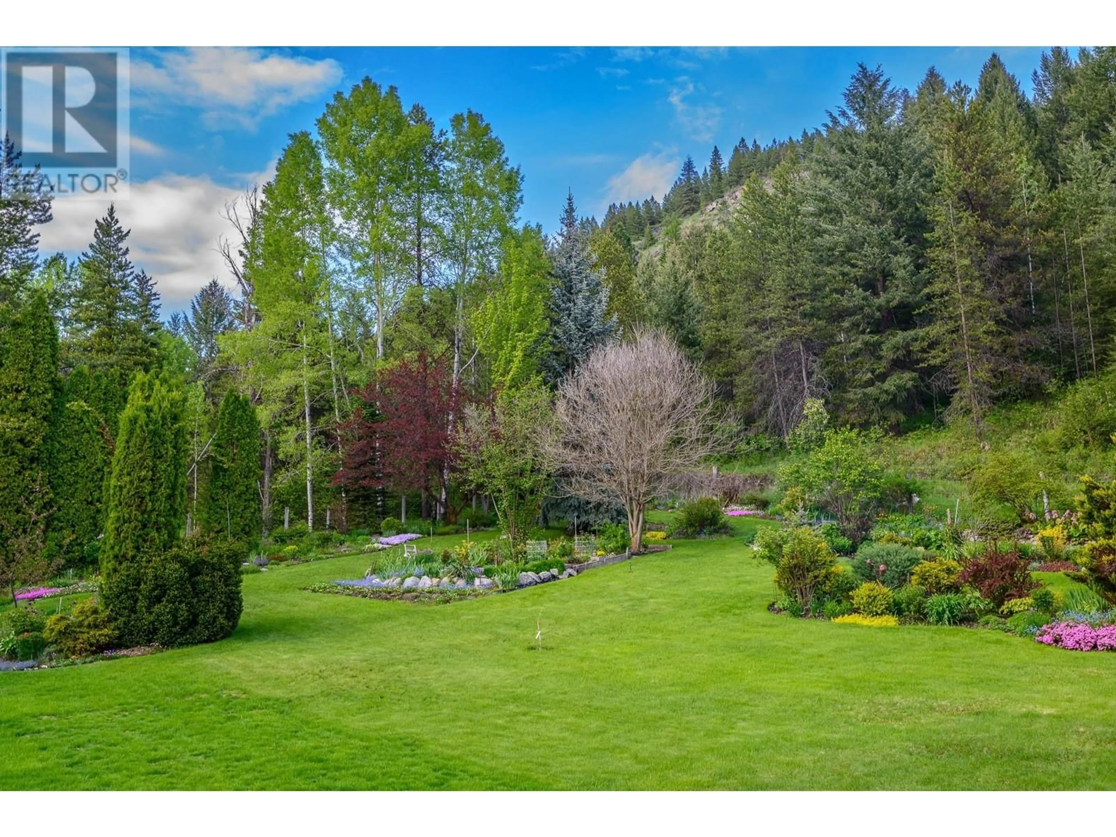 A pic from outside/outdoor area/front of a property/back of a property/a pic from drone, forest/trees view for 1075 Berta Street, Greenwood British Columbia V0H1J0