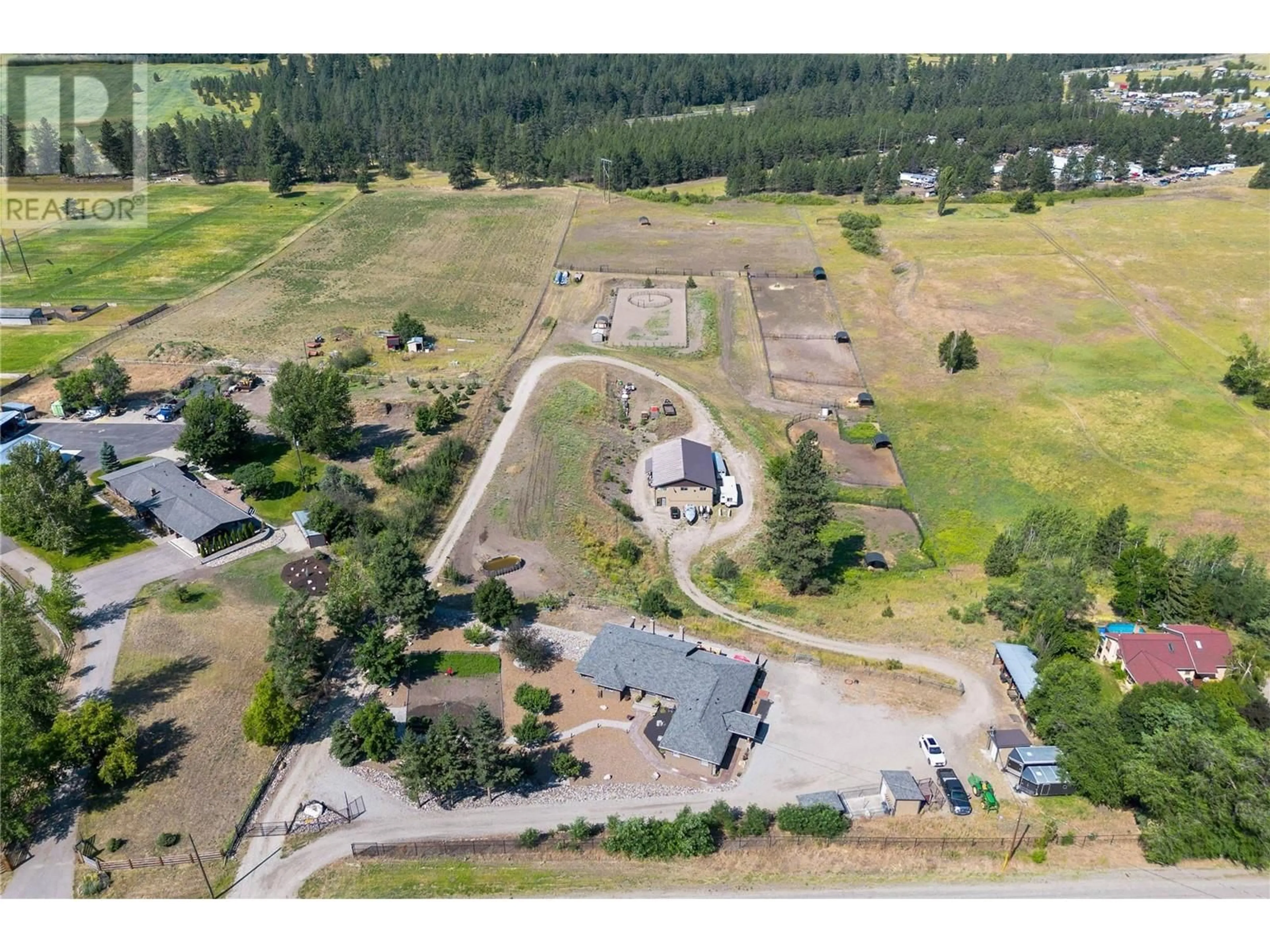 A pic from outside/outdoor area/front of a property/back of a property/a pic from drone, mountain view for 1258 Round Lake Road, Spallumcheen British Columbia V0E1B5