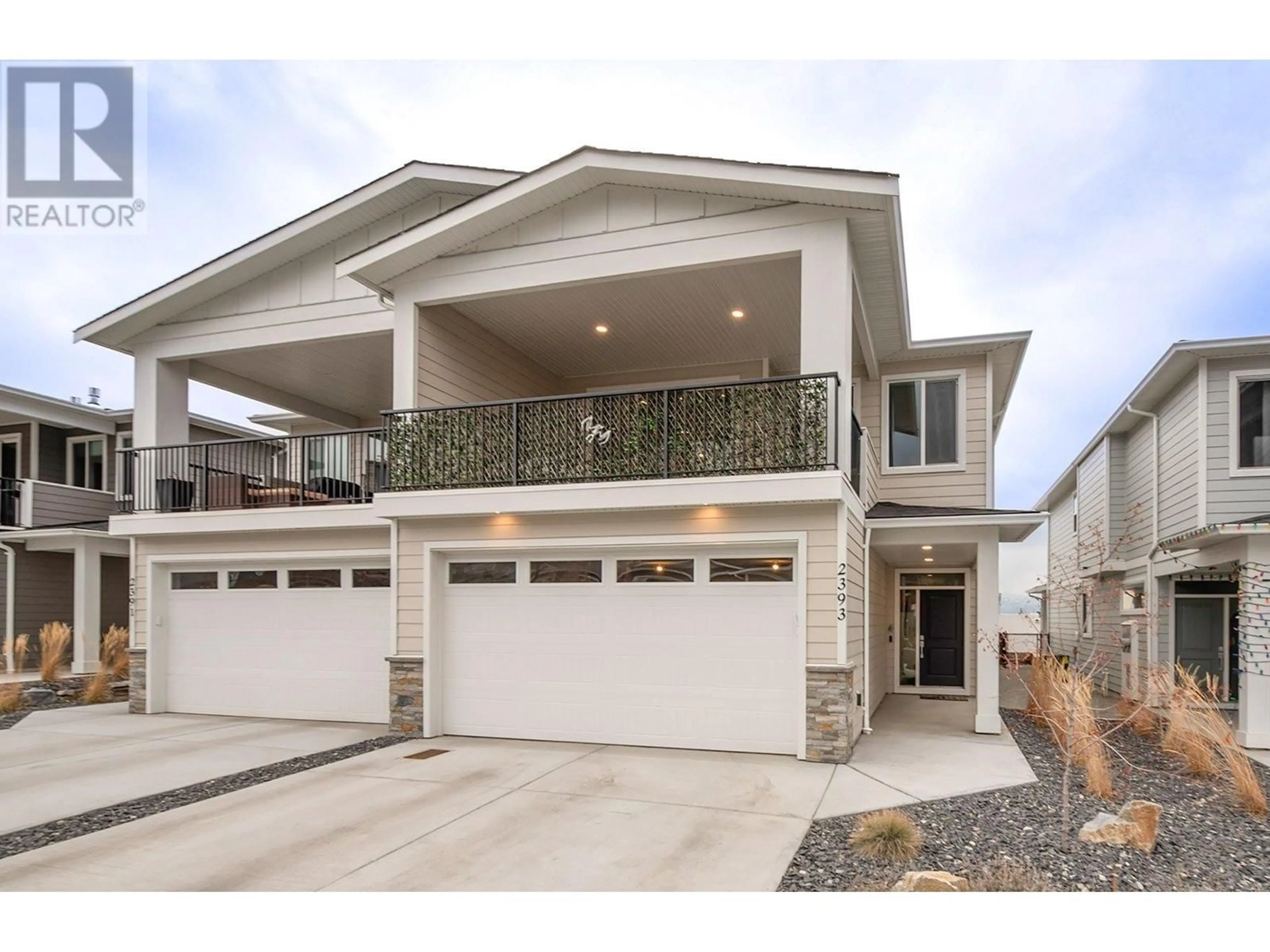 Home with vinyl exterior material, street for 2393 Hawks Boulevard, West Kelowna British Columbia V4T0A7