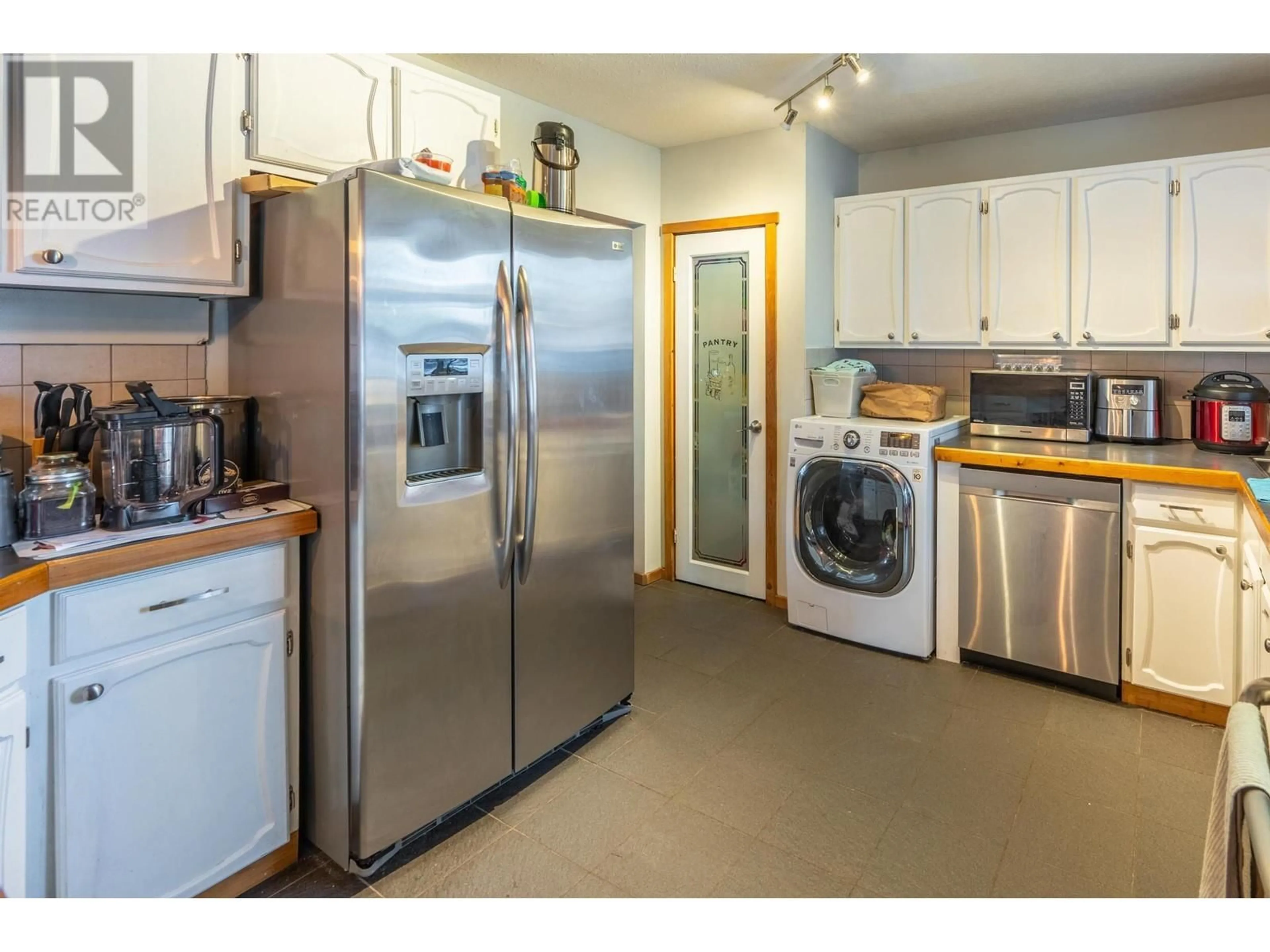 Kitchen with laundary machines, unknown for 505 6TH Street, Golden British Columbia V0A1H0