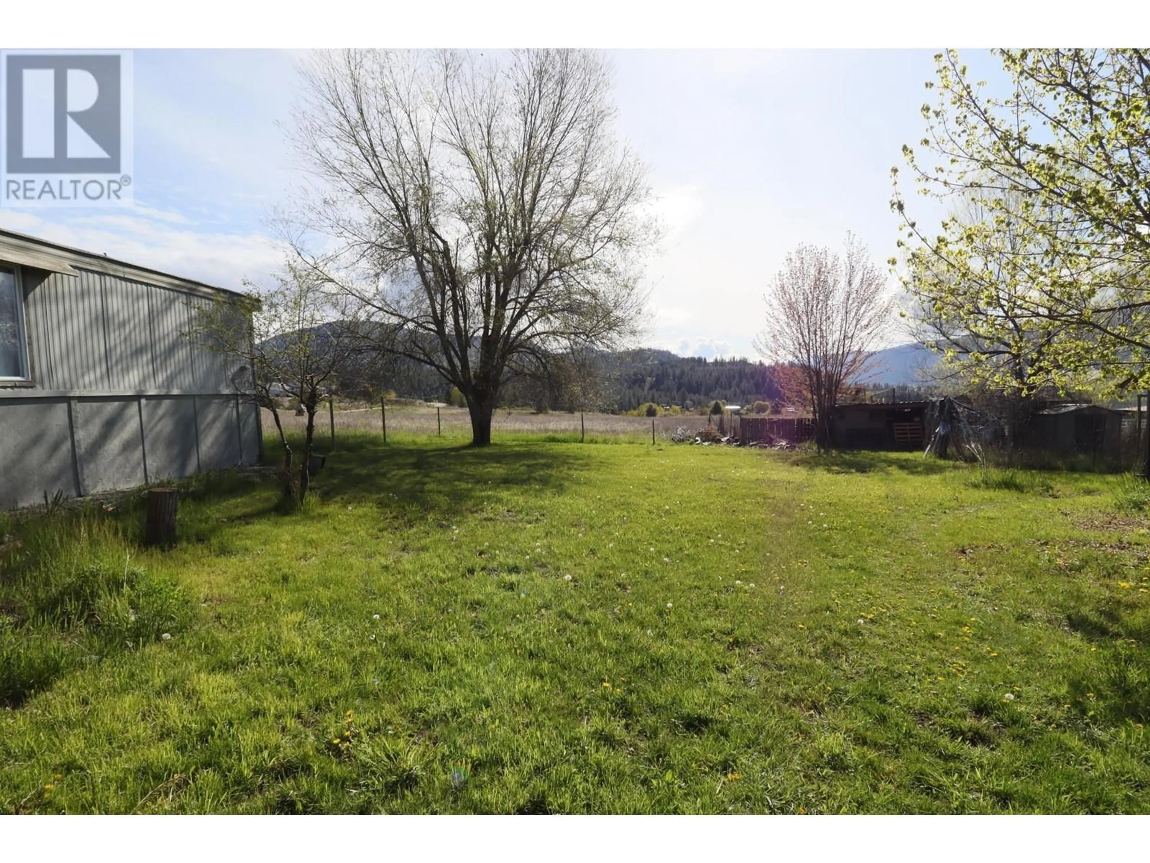 A pic from outside/outdoor area/front of a property/back of a property/a pic from drone, mountain view for 8390 OUTLOOK Road, Grand Forks British Columbia V0H1H2