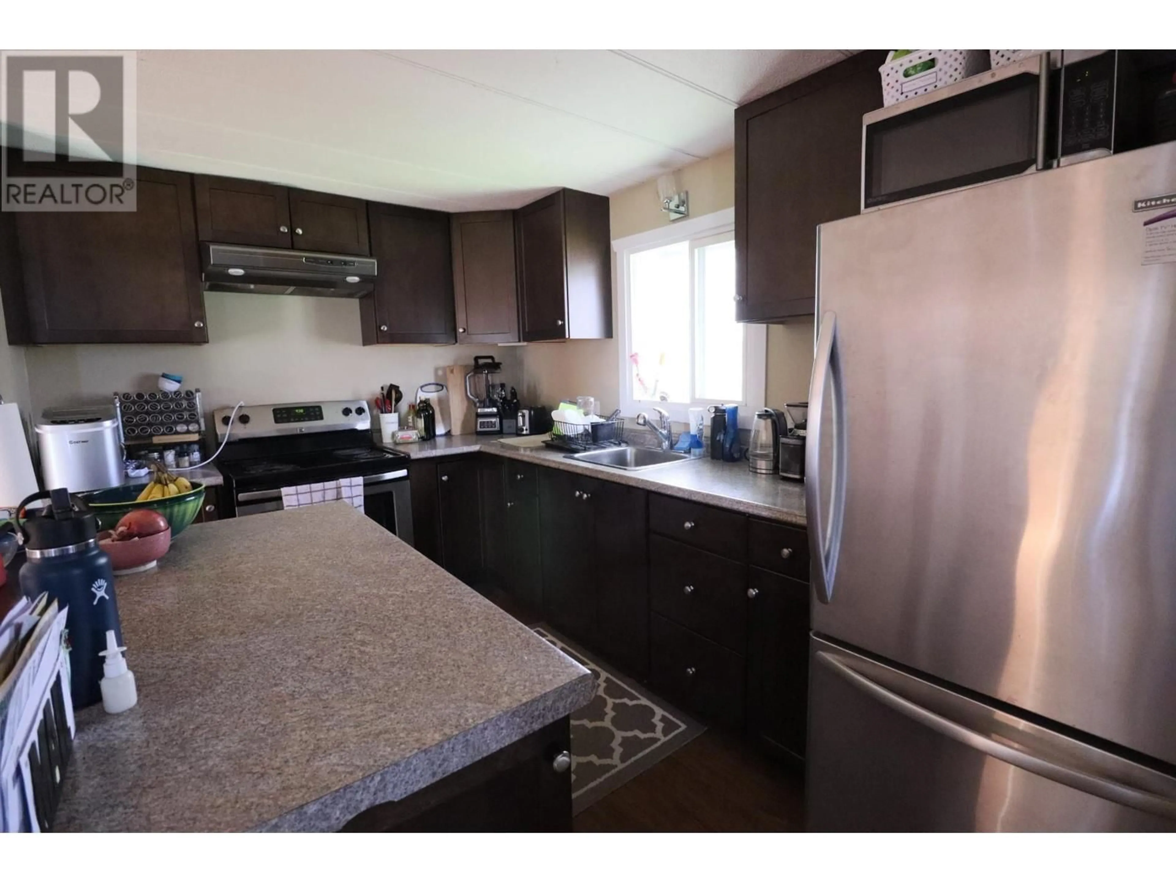 Standard kitchen, wood/laminate floor for 8390 OUTLOOK Road, Grand Forks British Columbia V0H1H2