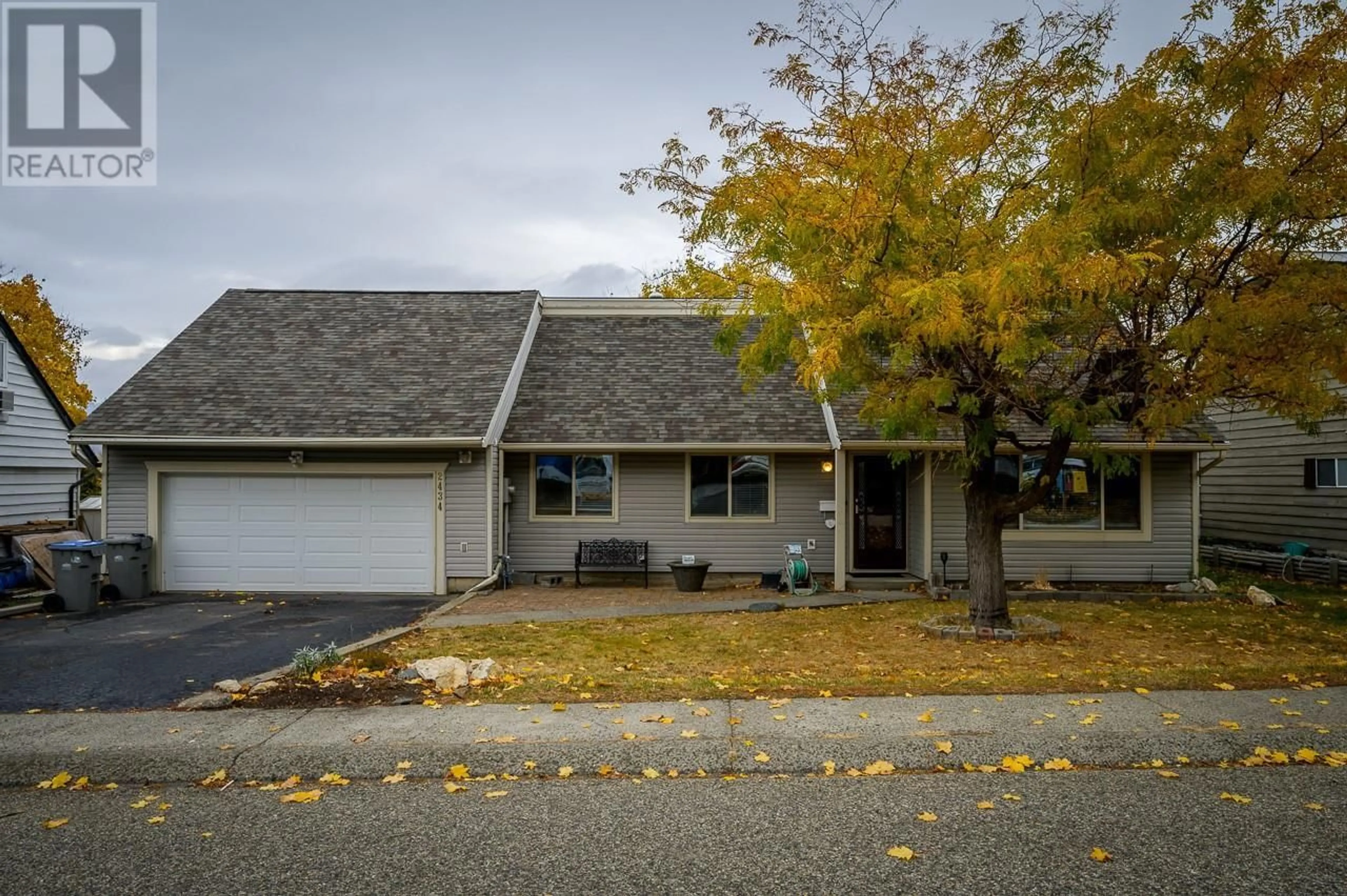 Home with vinyl exterior material, street for 2434 OMINECA Drive, Kamloops British Columbia V2E1V6