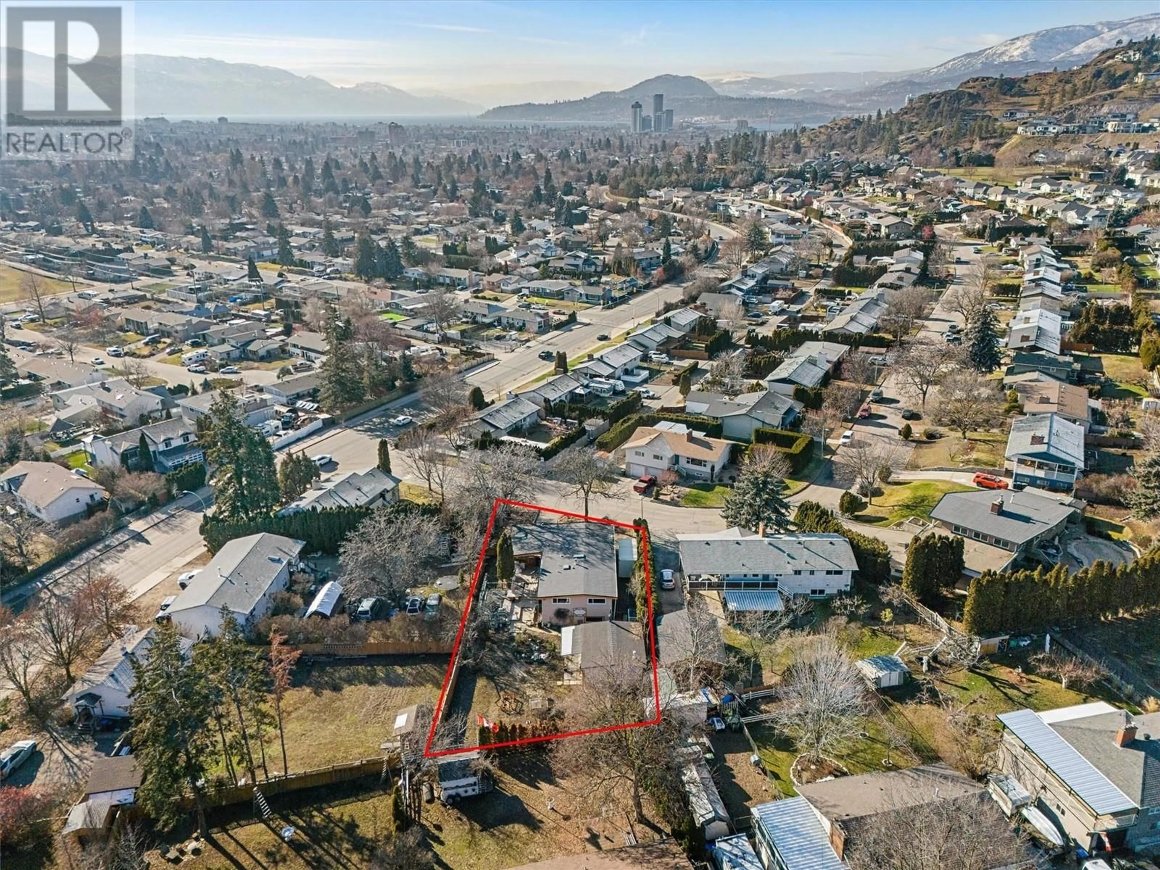 A pic from outside/outdoor area/front of a property/back of a property/a pic from drone, mountain view for 1792 Smithson Drive, Kelowna British Columbia V1Y4E3