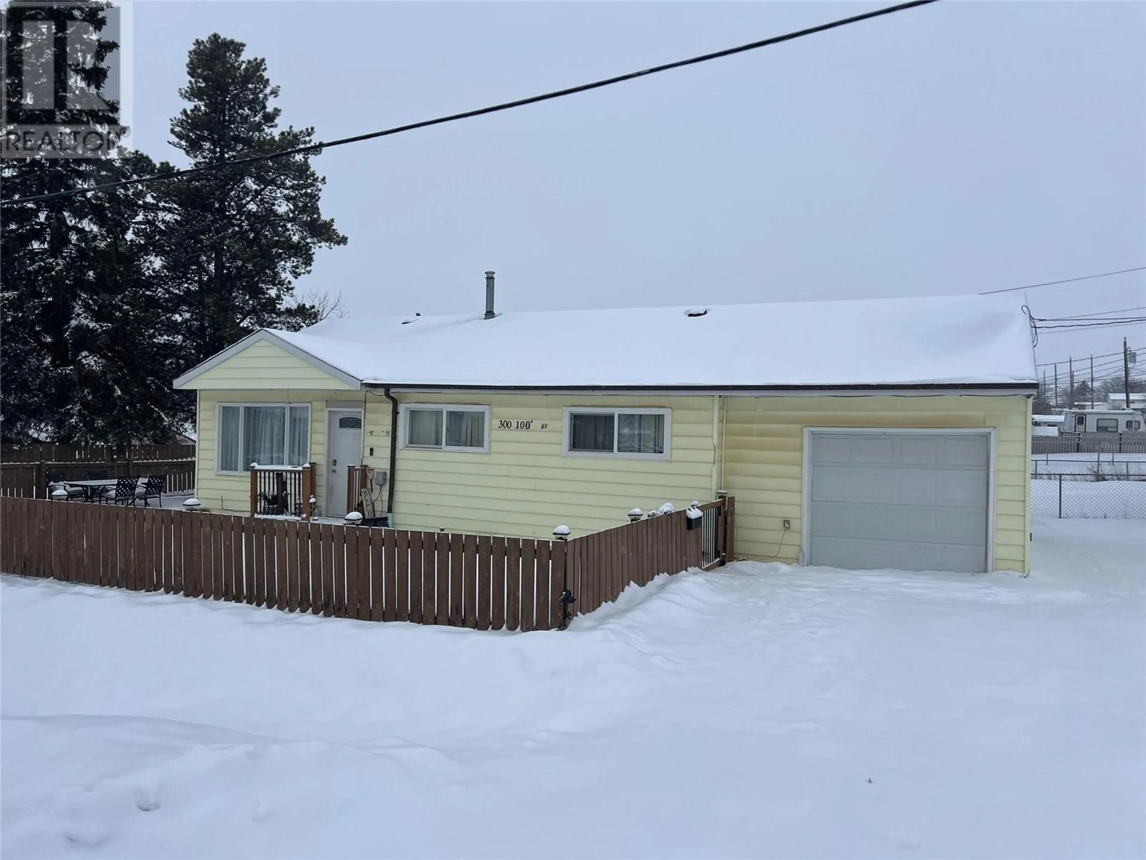 A pic from outside/outdoor area/front of a property/back of a property/a pic from drone, street for 300 100A Avenue, Dawson Creek British Columbia V1G1X4