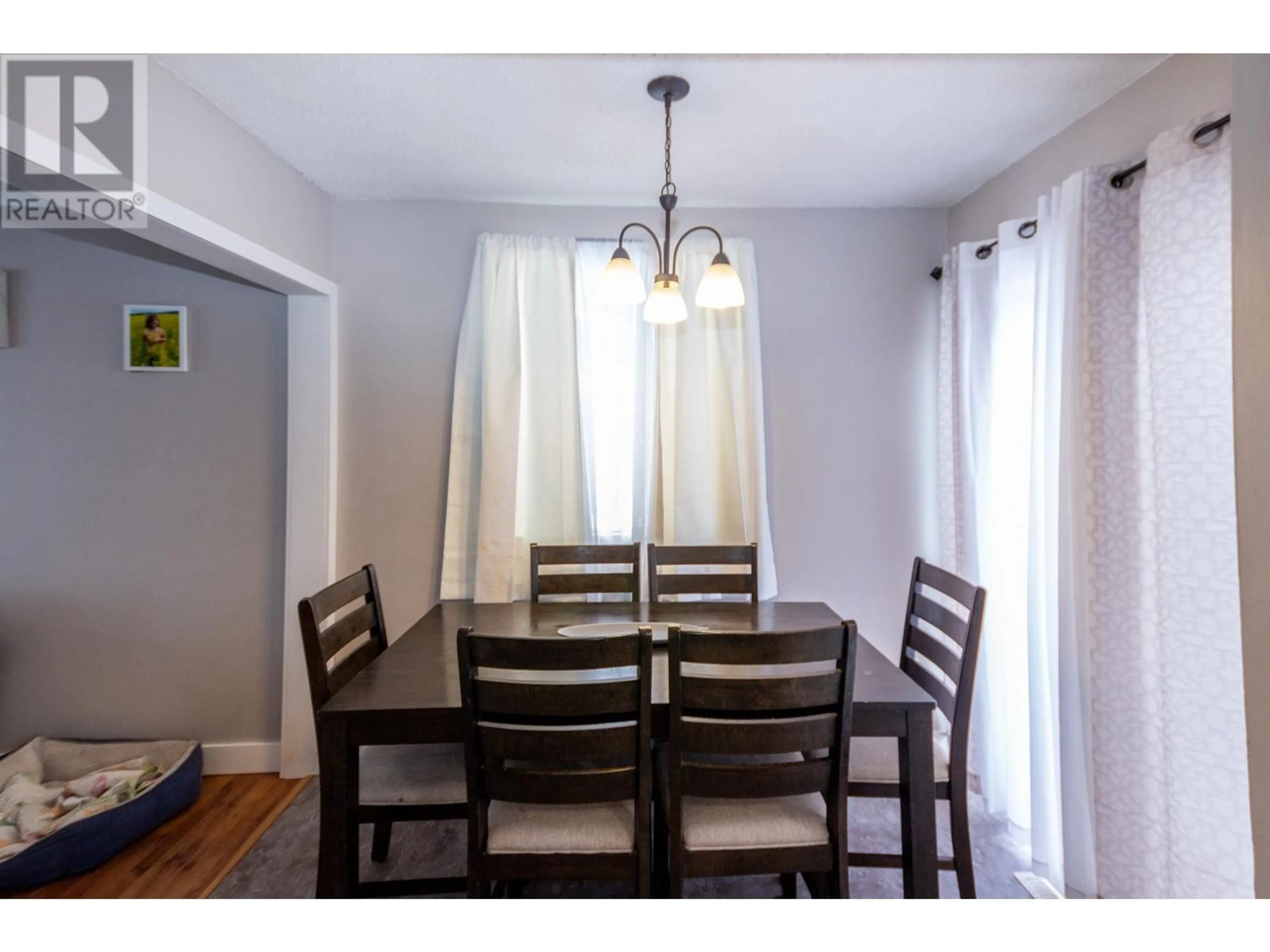 Dining room, wood/laminate floor for 300 100A Avenue, Dawson Creek British Columbia V1G1X4