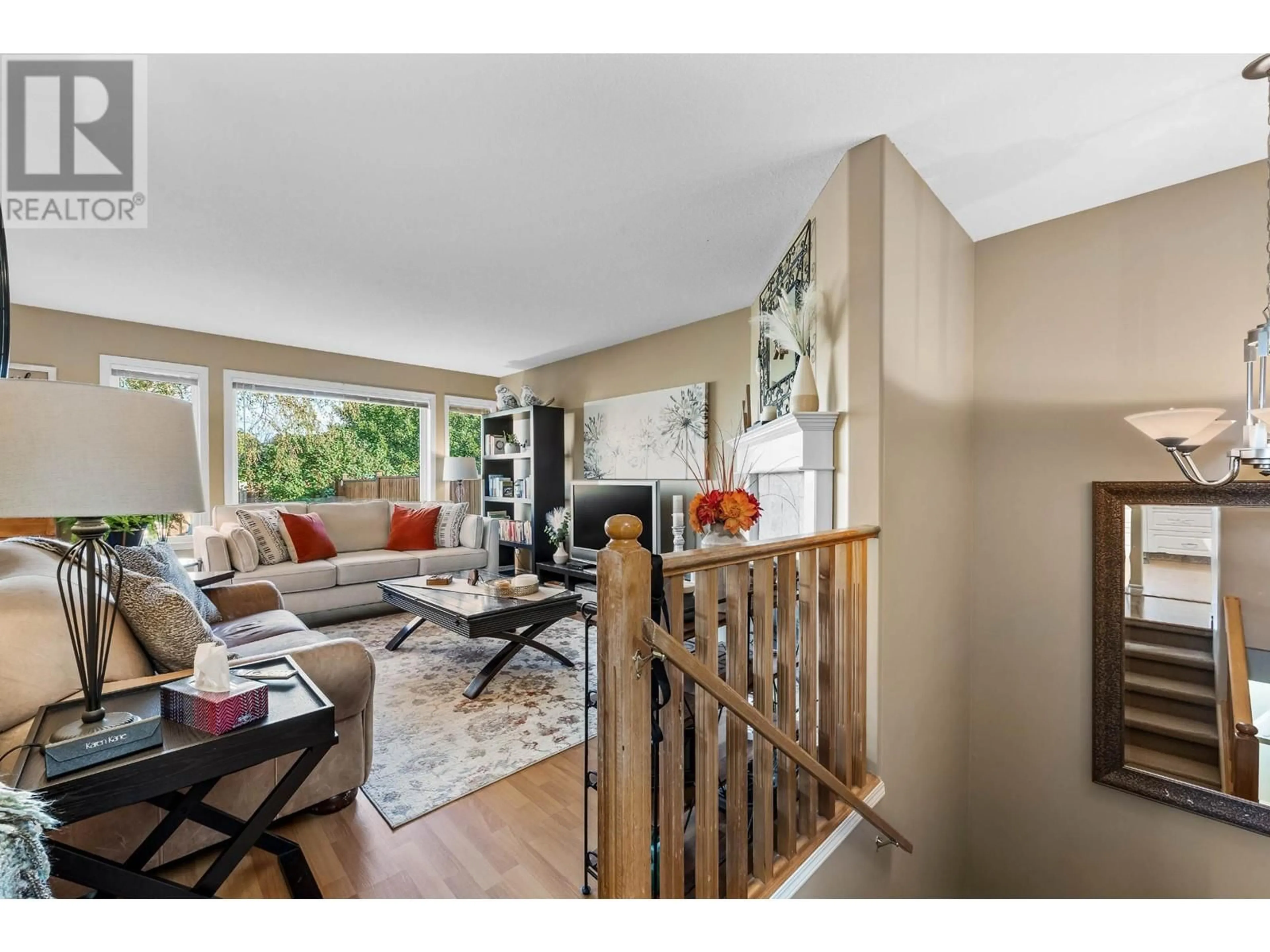 Living room with furniture, wood/laminate floor for 119 FERNIE Place, Kamloops British Columbia V2C6S4