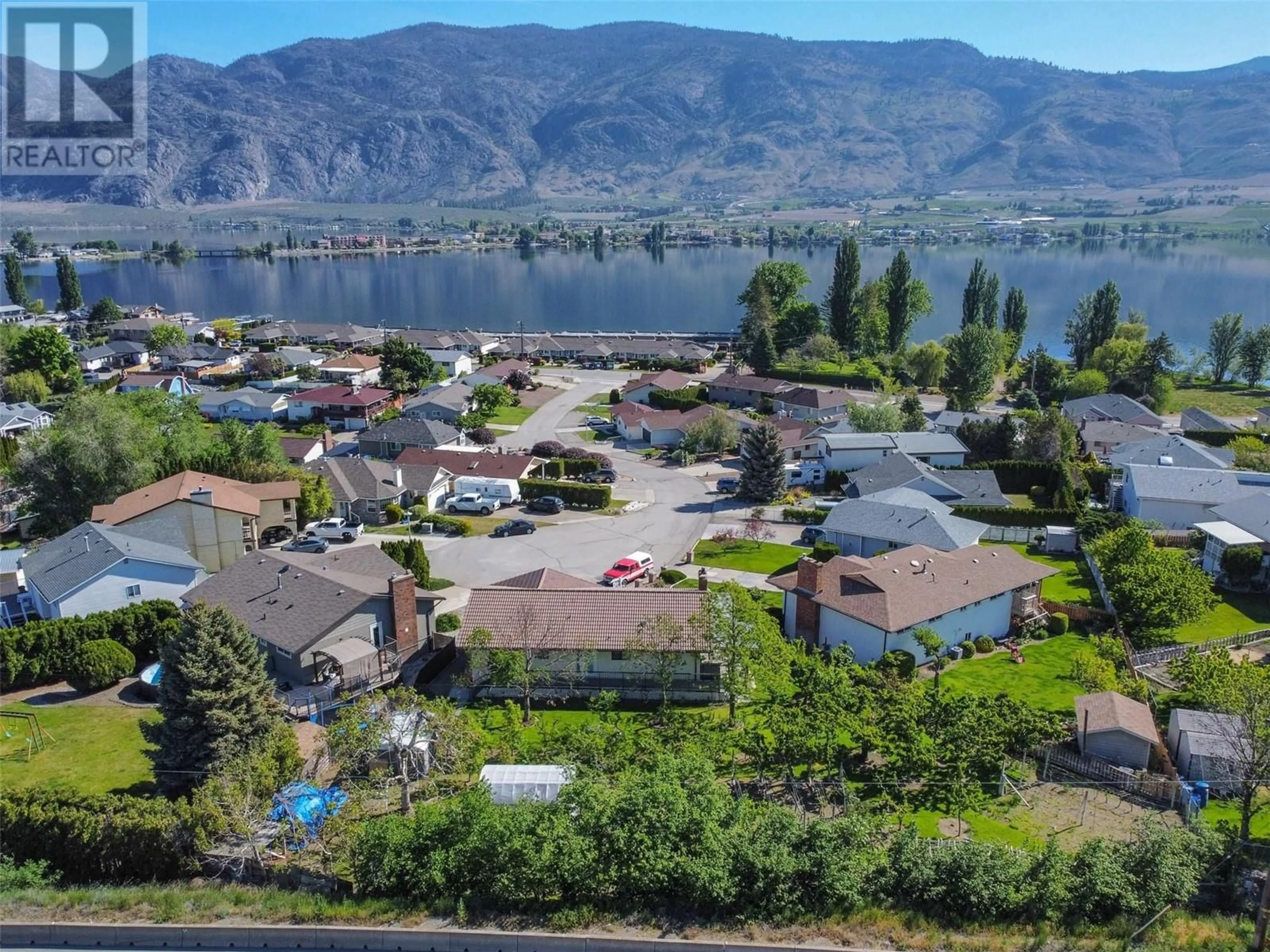 A pic from outside/outdoor area/front of a property/back of a property/a pic from drone, water/lake/river/ocean view for 18 HEATHER Place, Osoyoos British Columbia V0H1V1