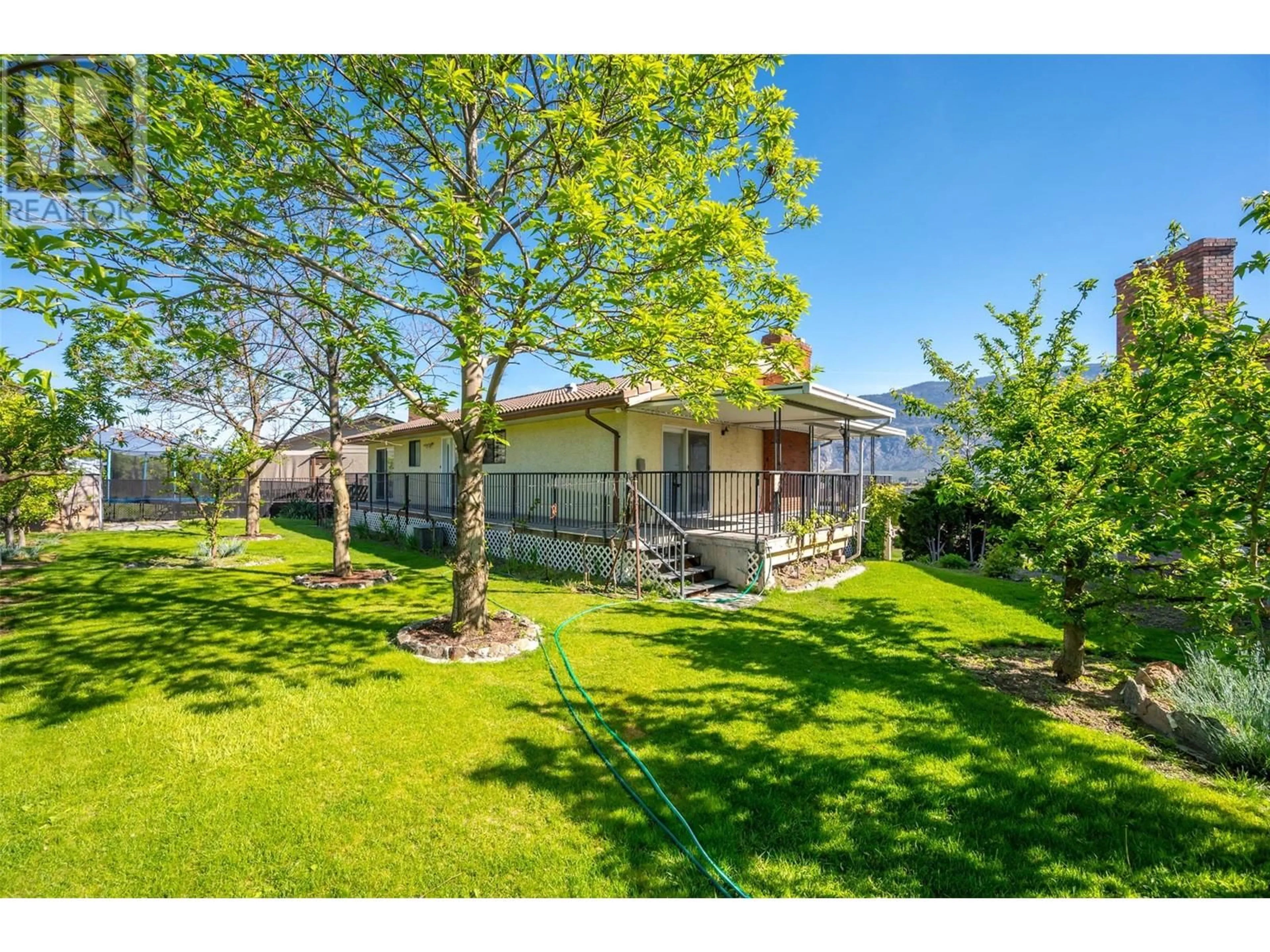 A pic from outside/outdoor area/front of a property/back of a property/a pic from drone, street for 18 HEATHER Place, Osoyoos British Columbia V0H1V1