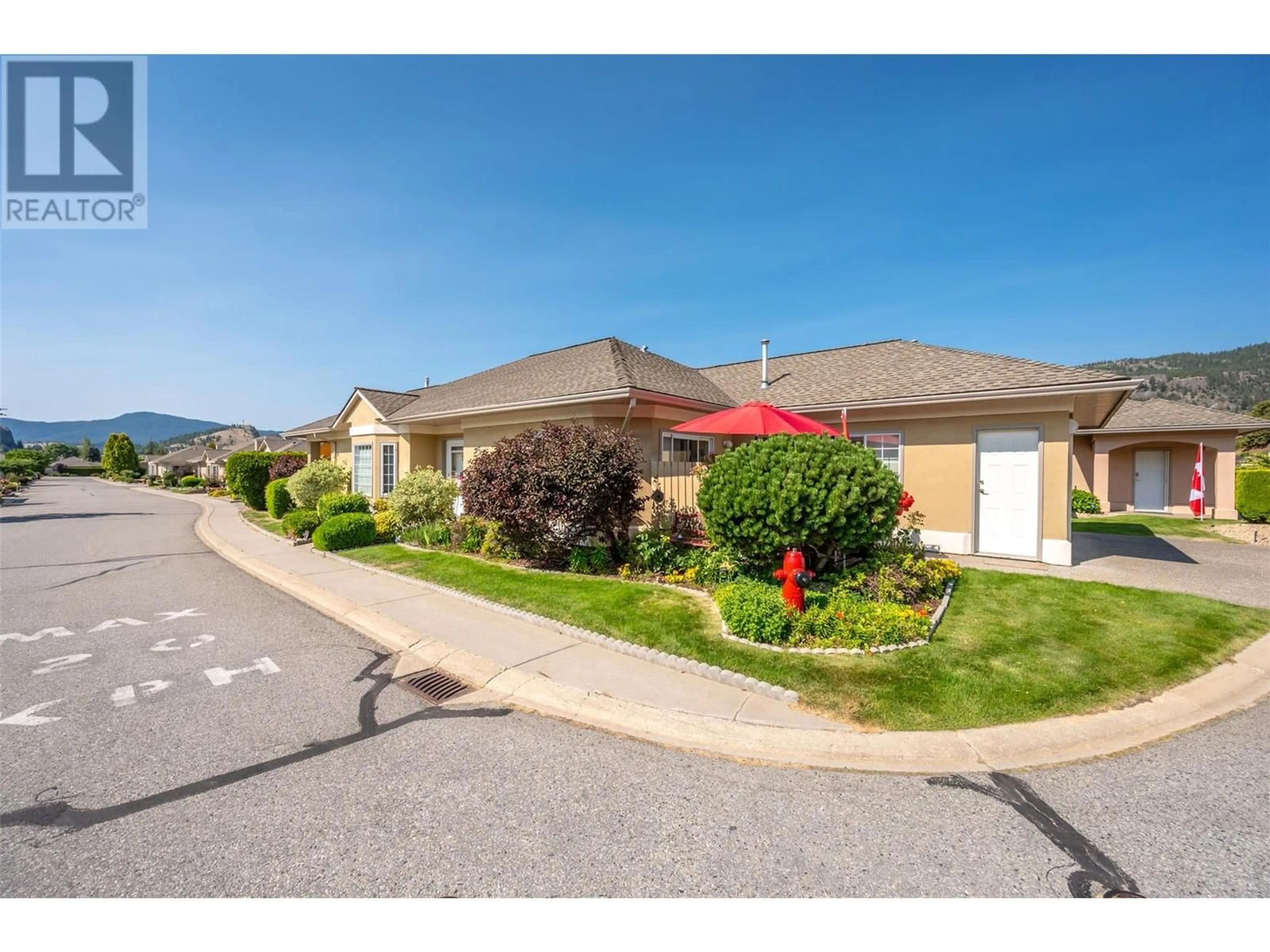 A pic from outside/outdoor area/front of a property/back of a property/a pic from drone, street for 55 - 9800 TURNER STREET, Summerland British Columbia V0H1Z5