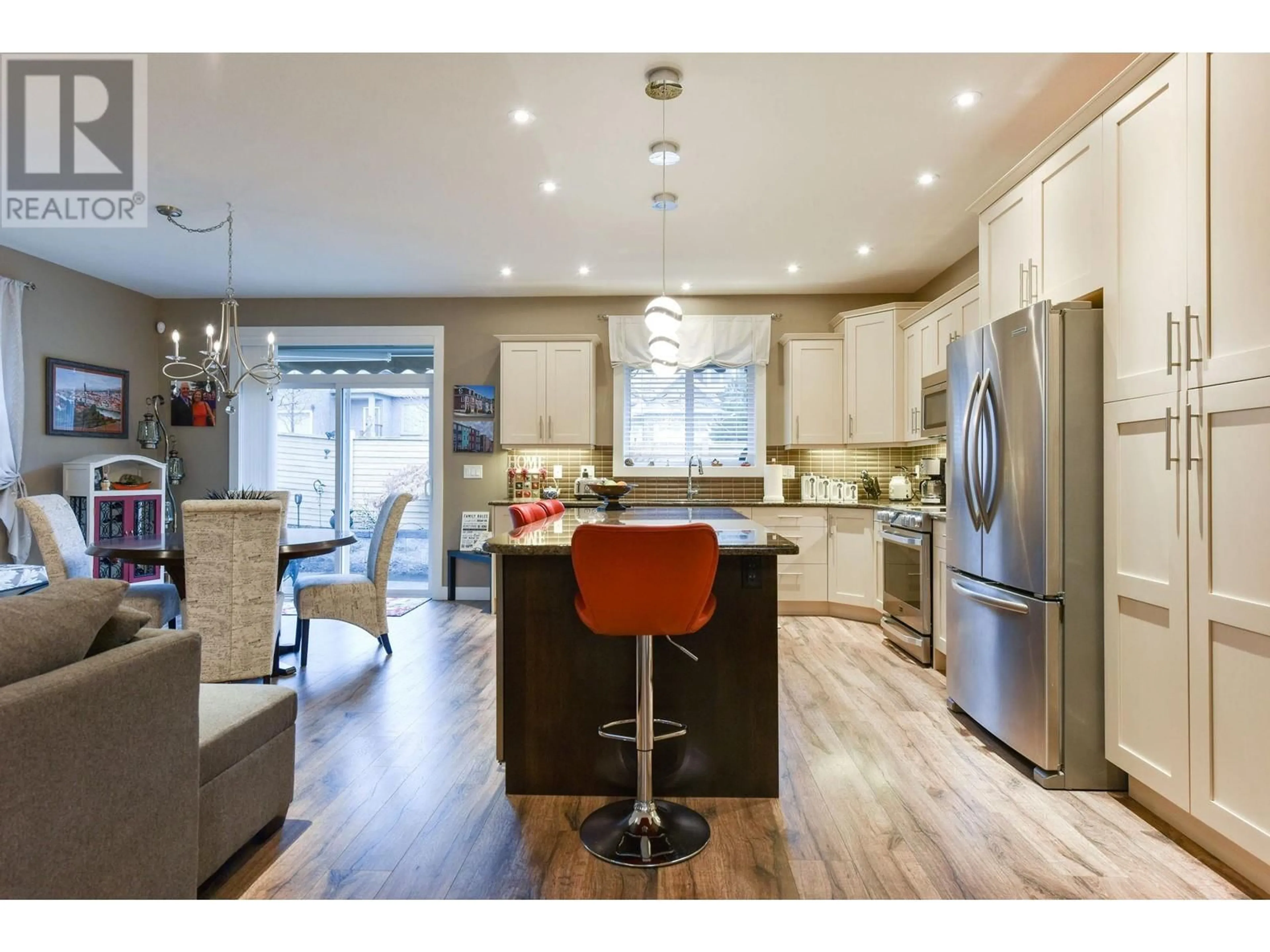 Open concept kitchen, wood/laminate floor for 148 - 170 STOCKS CRESCENT, Penticton British Columbia V2A9C6