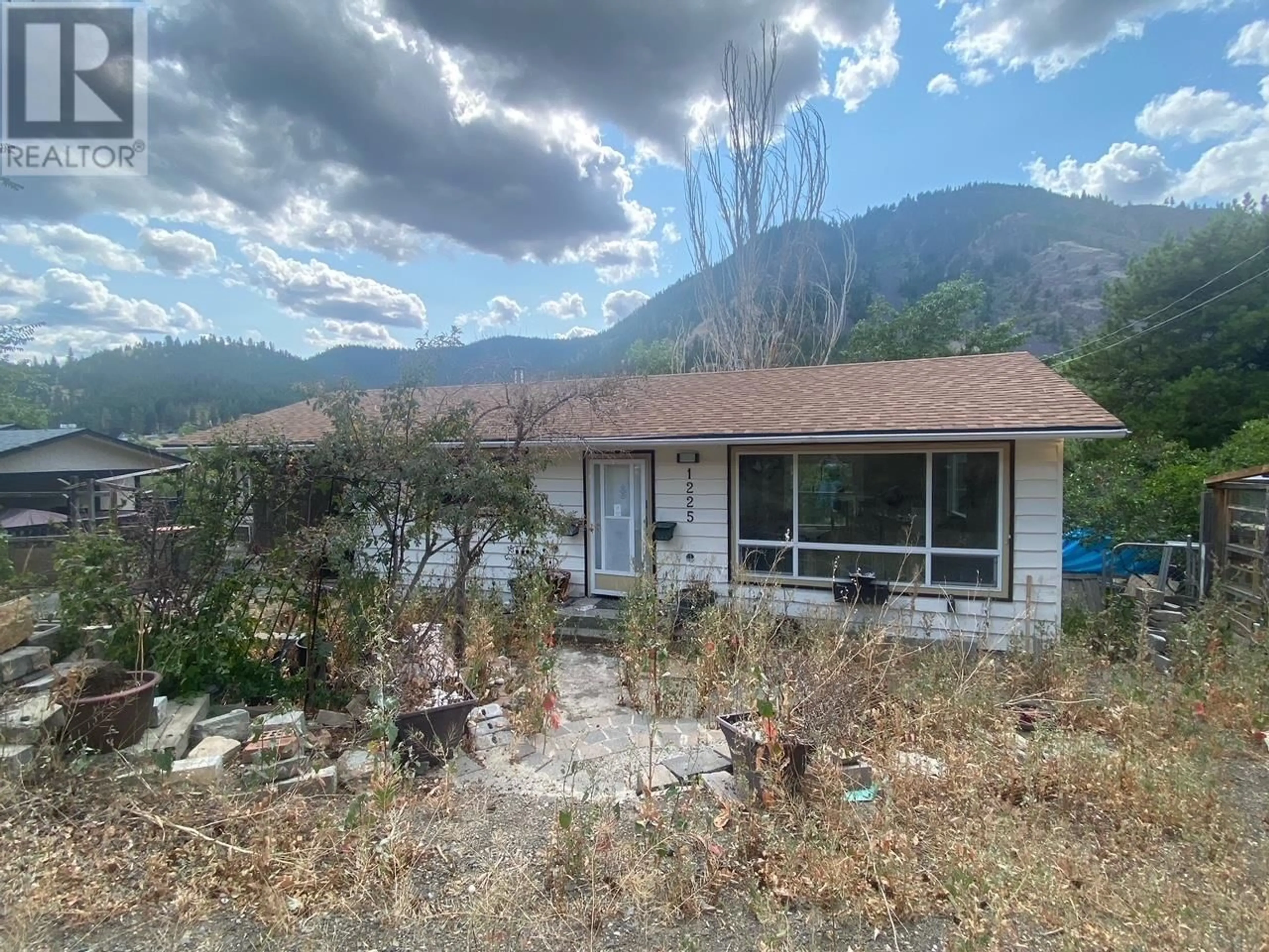 A pic from outside/outdoor area/front of a property/back of a property/a pic from drone, mountain view for 1225 HIGHRIDGE DRIVE, Kamloops British Columbia V2C5G5
