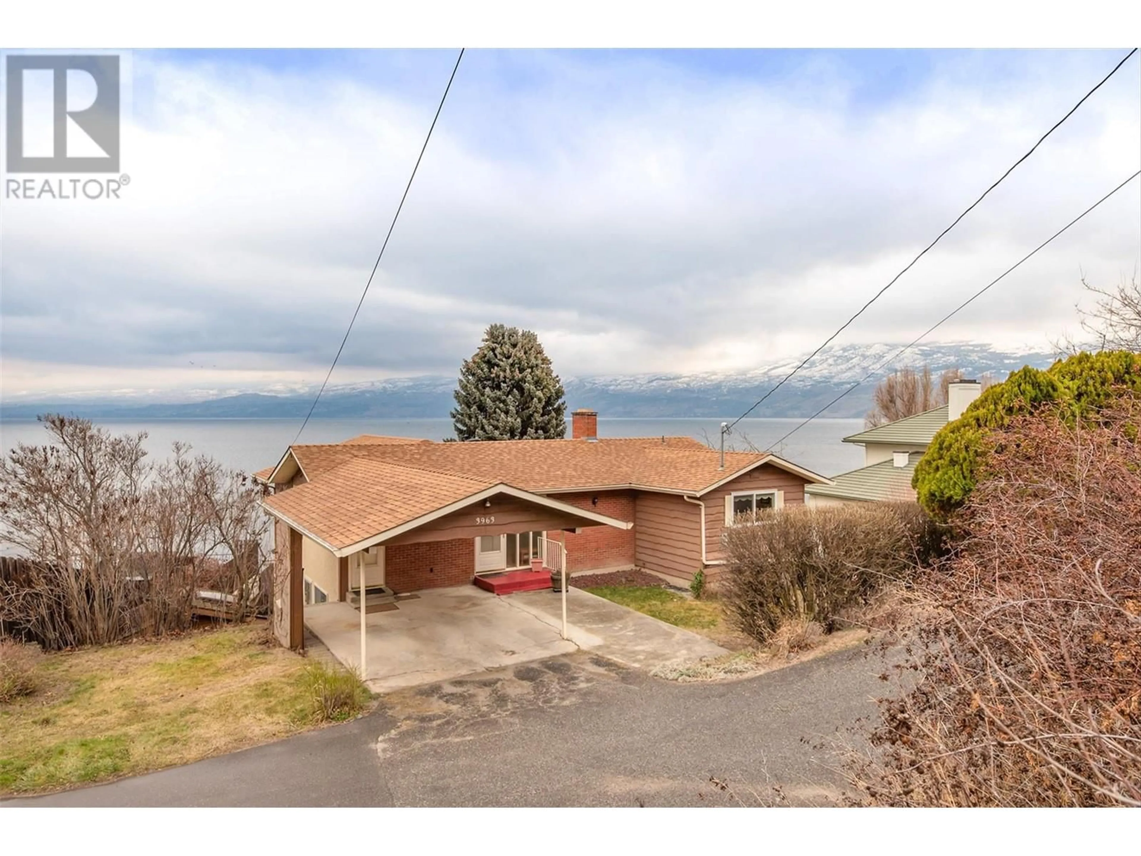 A pic from outside/outdoor area/front of a property/back of a property/a pic from drone, mountain view for 3963 Angus Drive, West Kelowna British Columbia V4T2K1