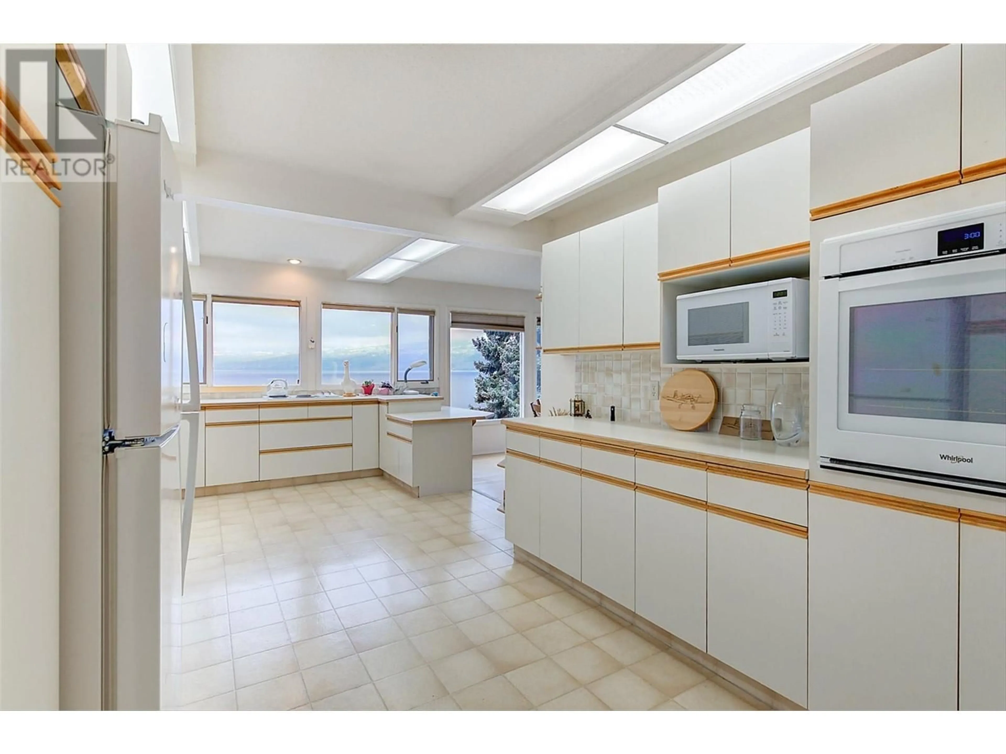 Open concept kitchen, ceramic/tile floor for 3963 Angus Drive, West Kelowna British Columbia V4T2K1