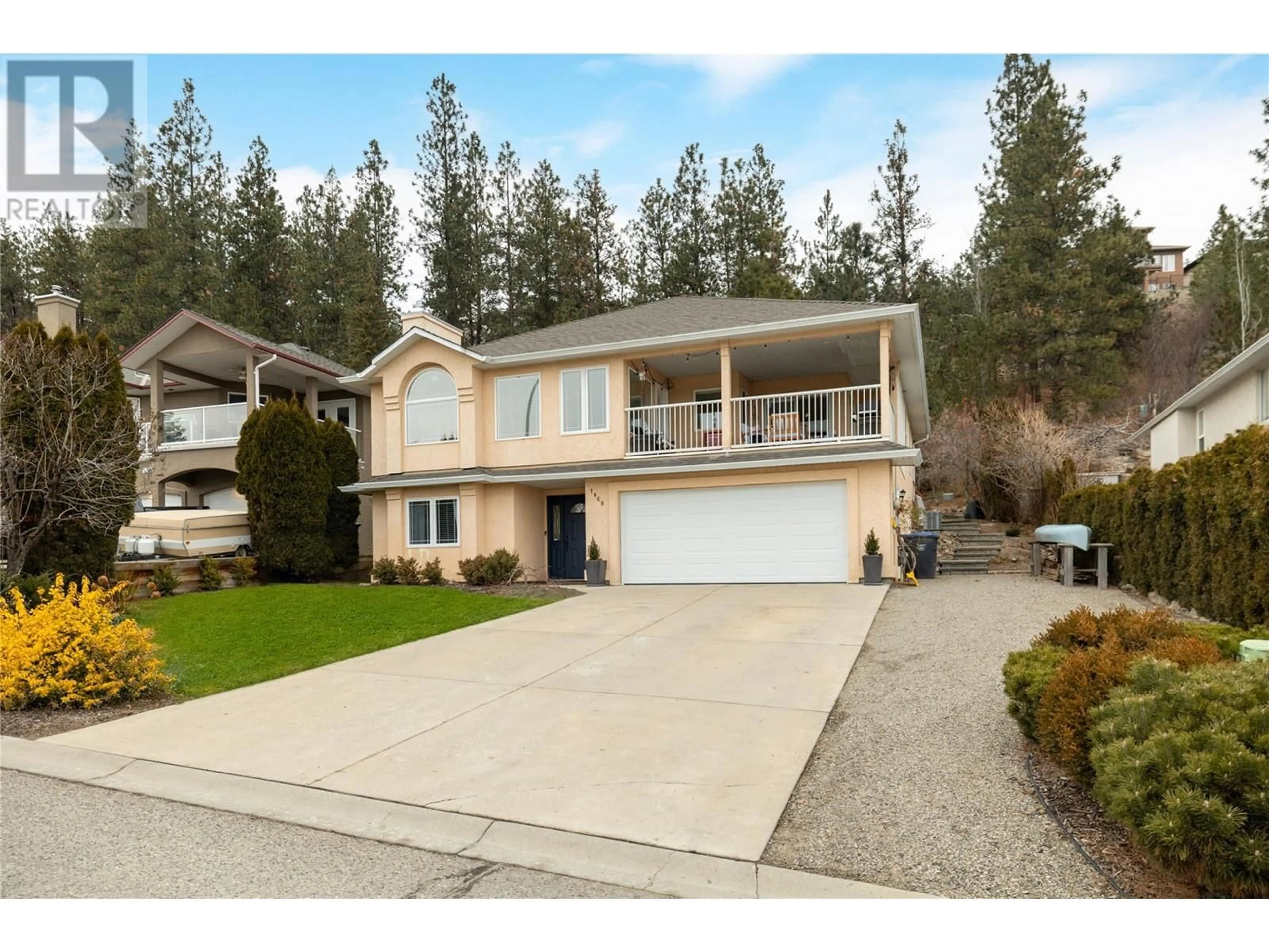 Home with vinyl exterior material, street for 1068 CALEDONIA WAY, West Kelowna British Columbia V1Z3N7